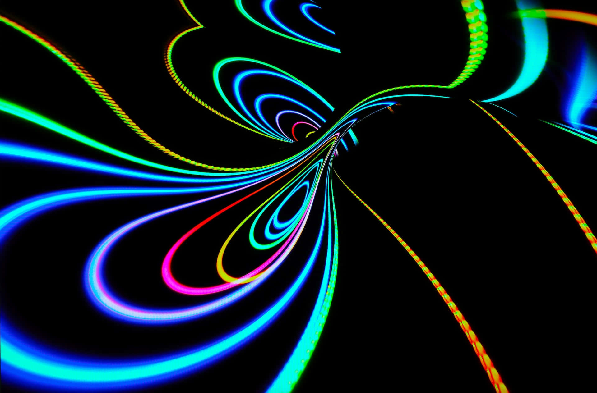 Psychedelic Neon Lights 桌布 壁紙 — 充滿活力的霓虹燈光軌跡在漆黑的背景上旋轉成一個催眠般的隧道。