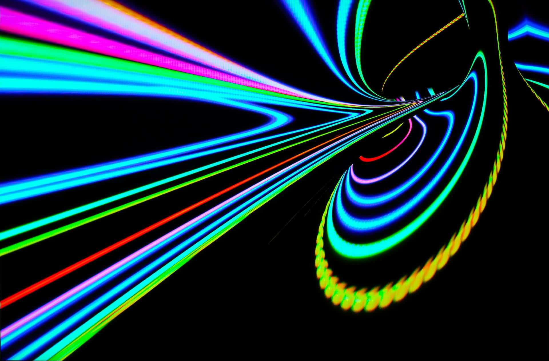 Psychedelic Neon Lights 桌布 壁紙 — 充滿活力的霓虹燈光軌跡在黑色虛空中螺旋和劃過，形成動態隧道效果。