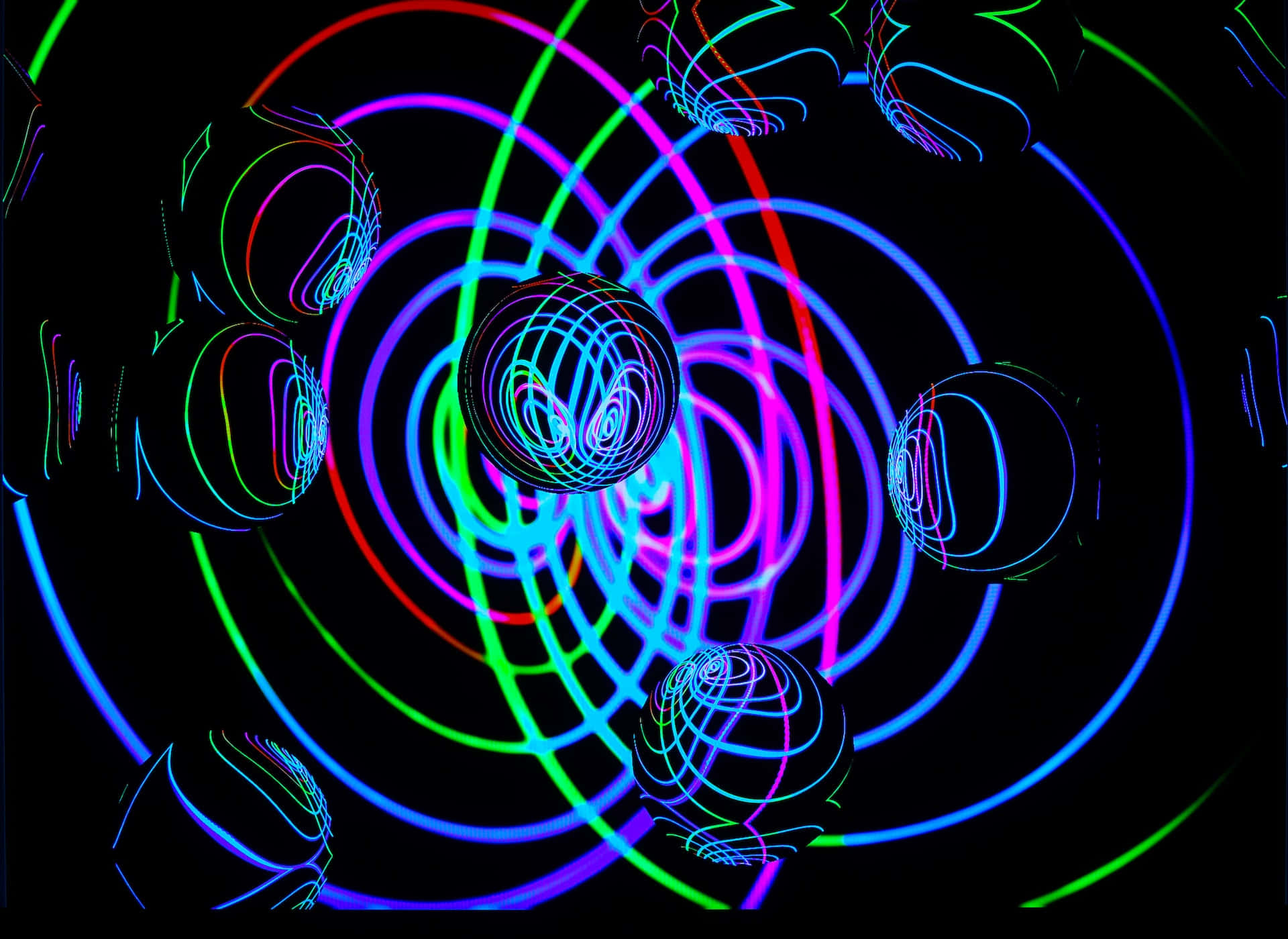 Psychedelic Neon Lights 桌布 壁紙 — 充滿活力的霓虹球體和旋轉的線條在黑色虛空中發光，形成迷人的數碼隧道。