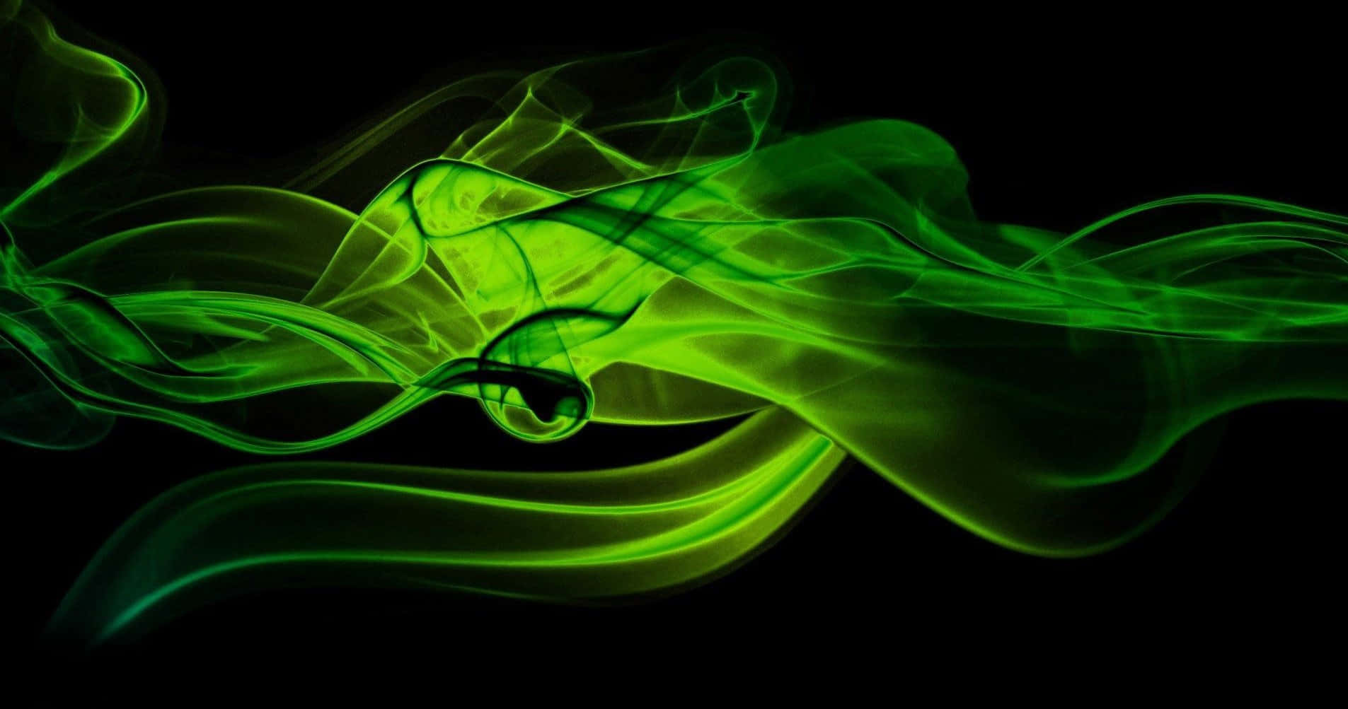 Green Smoke 桌布 壁紙 — 充滿活力的霓虹綠色煙霧在純黑色背景上優雅地流動，形成動態的抽象運動。
