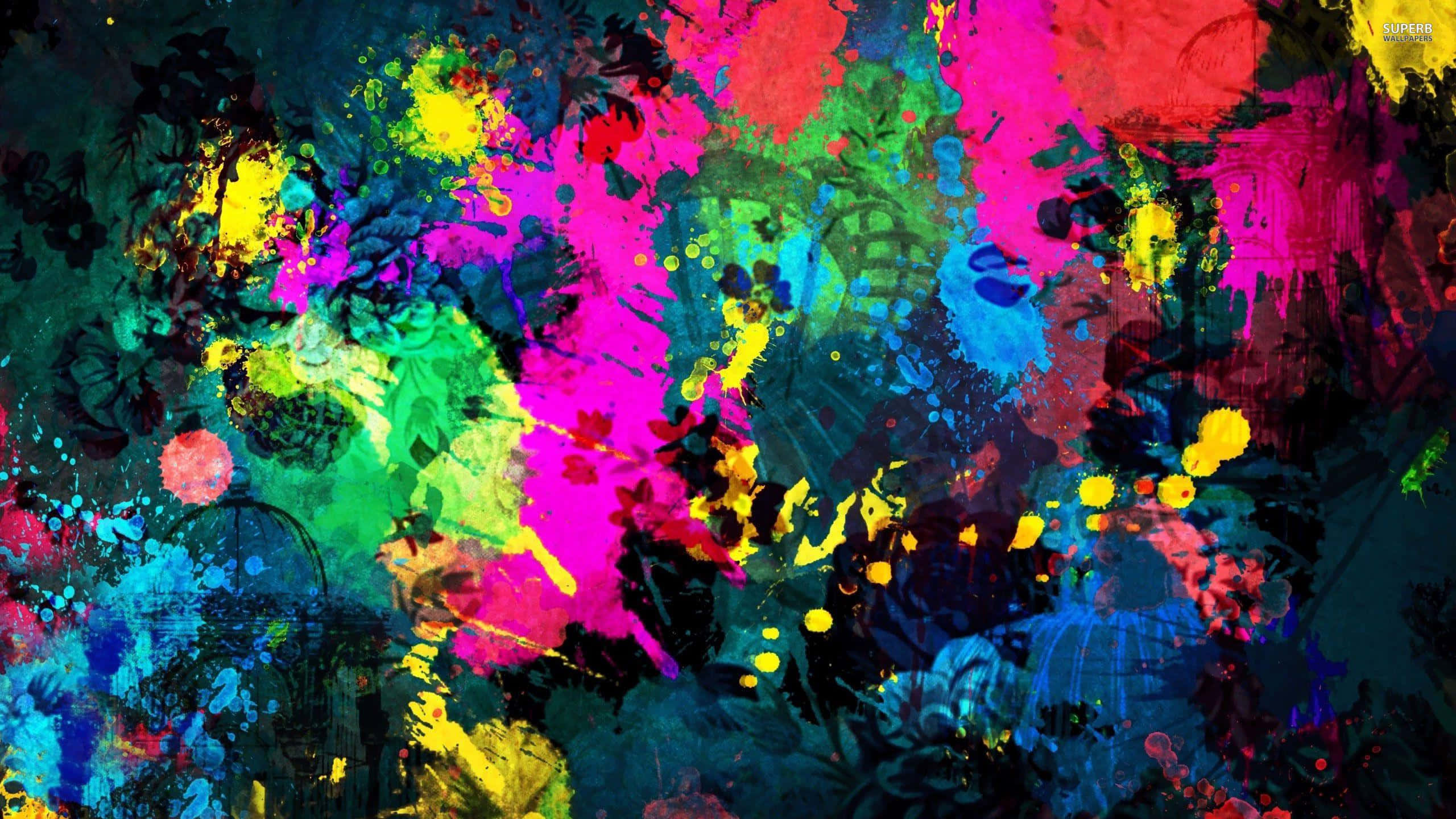 Paint Art 桌布 壁紙 — 充滿活力的霓虹顏料飛濺在深藍綠色背景上爆炸，形成混亂的抽象構圖。