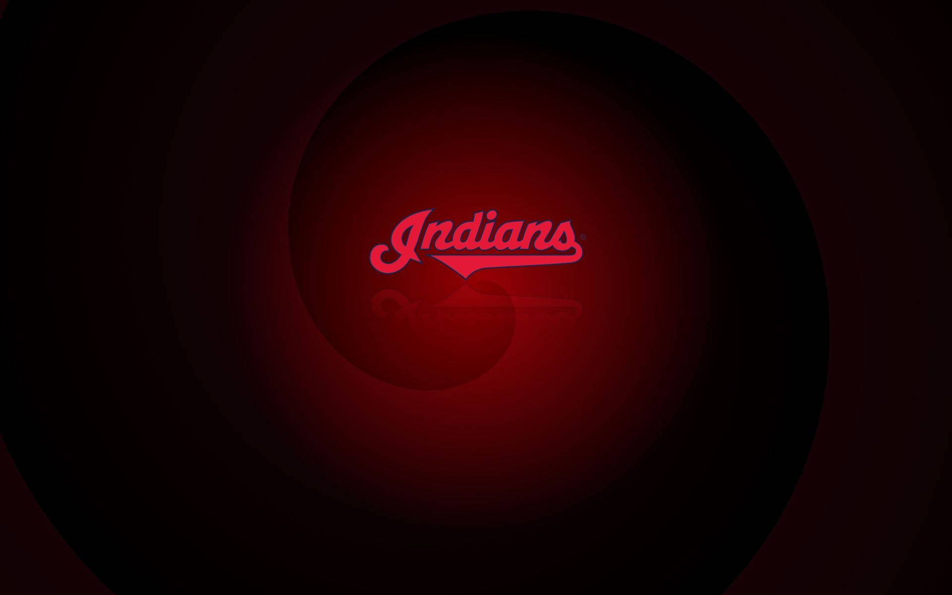 克里夫蘭印第安人熱力霓虹粉 壁紙 — 一個發光的紅色「Indians」標誌，位於黑暗圓形隧道中央，帶有徑向光線漸變。
