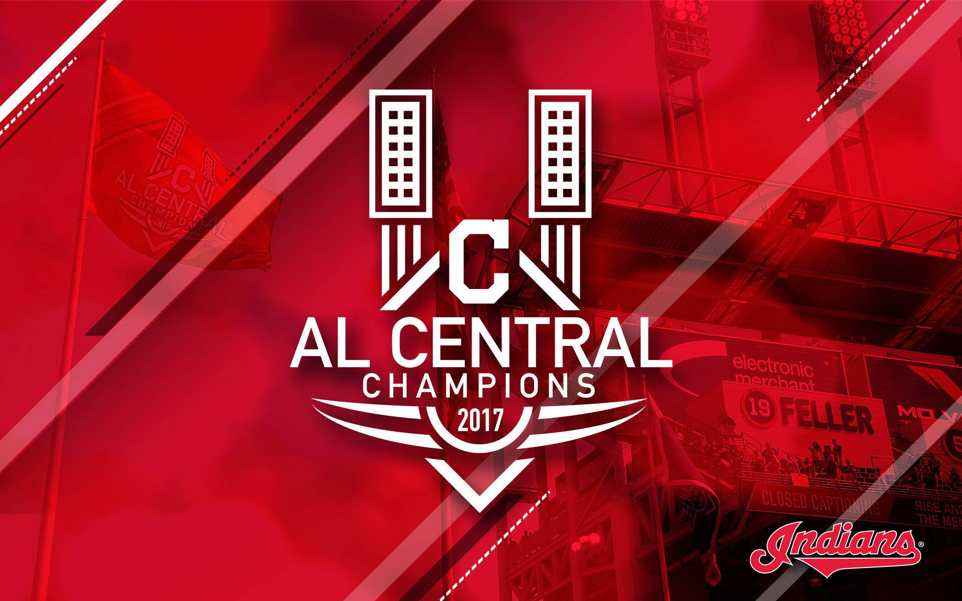 克里夫蘭印第安人隊中央冠軍 壁紙 — 大膽的白色AL Central Champions 2017標誌主導了帶有紅色色調的棒球場背景，可見標牌和旗幟。