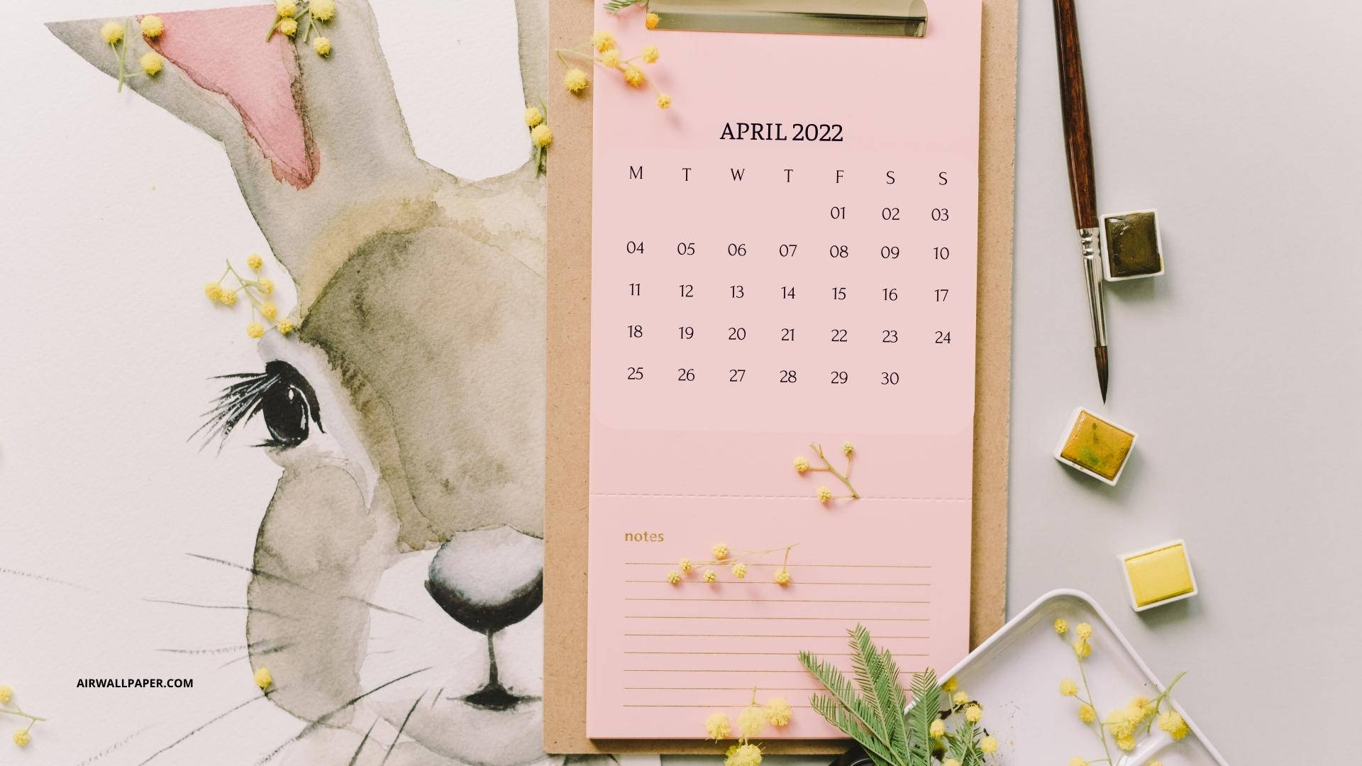 水彩兔仔插圖旁邊係2022年4月月曆，有黃色花同美術用品。