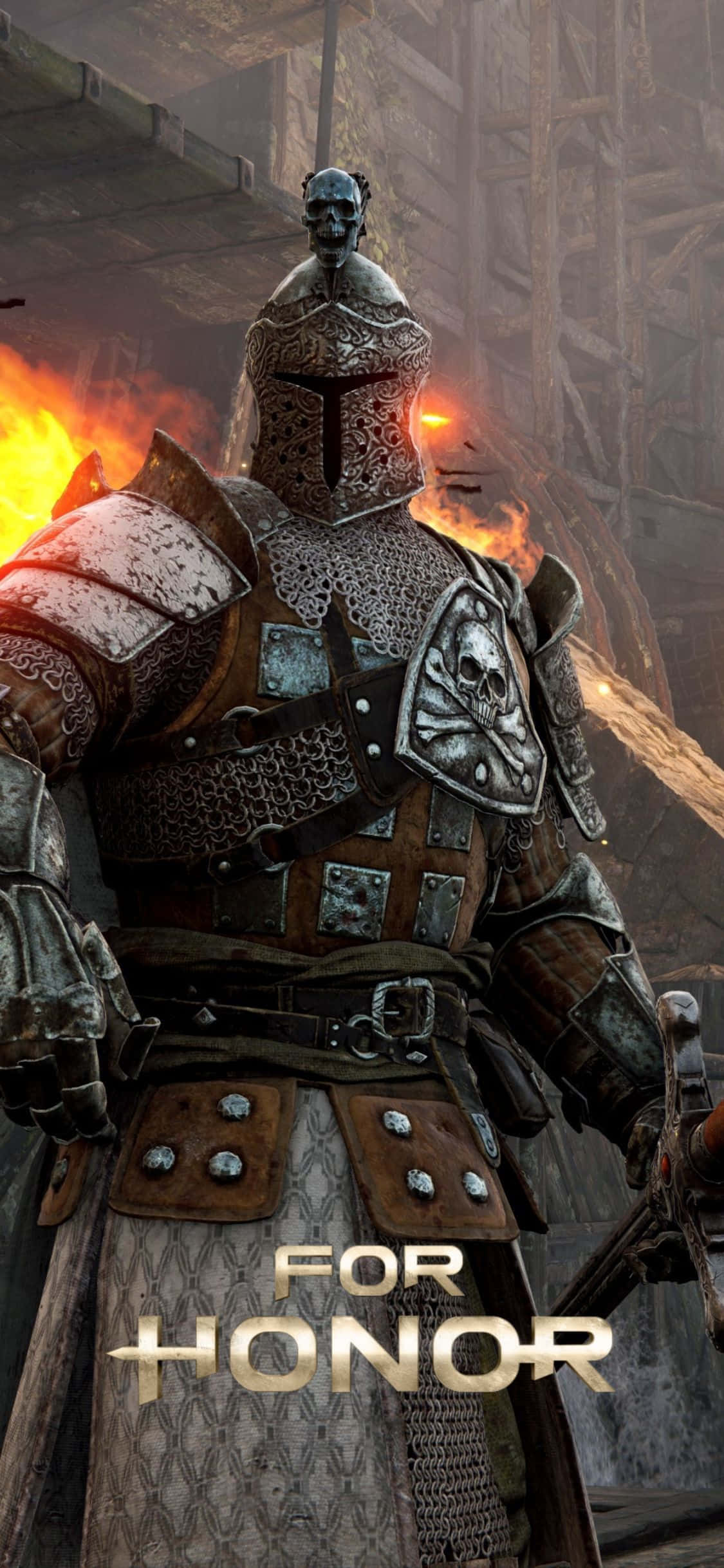 全新 iPhone Xs For Honor，完美連接與同步 壁紙 — 一個高大的裝甲戰士，帶有骷髏圖案，站在黑暗中世紀背景的燃燒廢墟中。