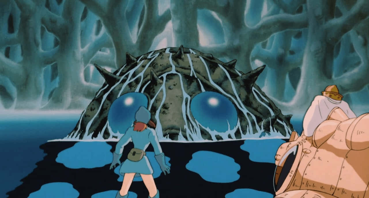 nausicaä of the valley of the wind 桌布 壁紙 — 兩位冒險者在超現實的藍色洞穴中面對一隻擁有發光藍色眼睛的巨型尖刺生物。