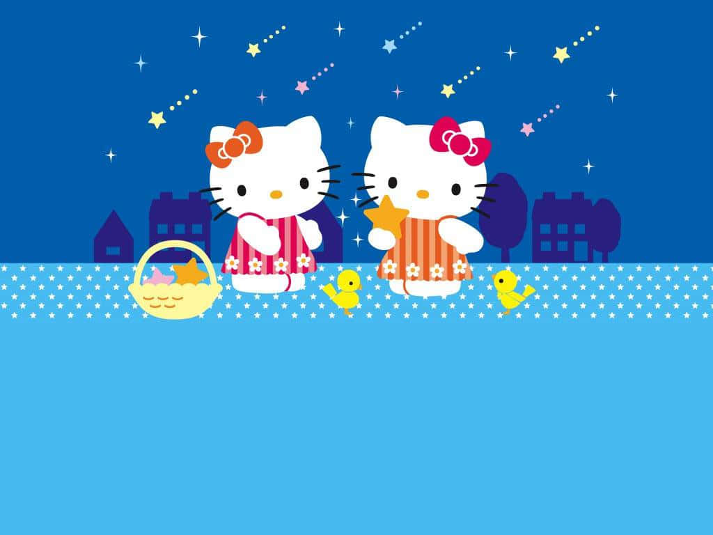 Hello Kitty Christmas 桌布 壁紙 — 兩個Hello Kitty角色穿著星空睡衣，在閃爍的天空下，旁邊有黃色小雞，手持星星和籃子。