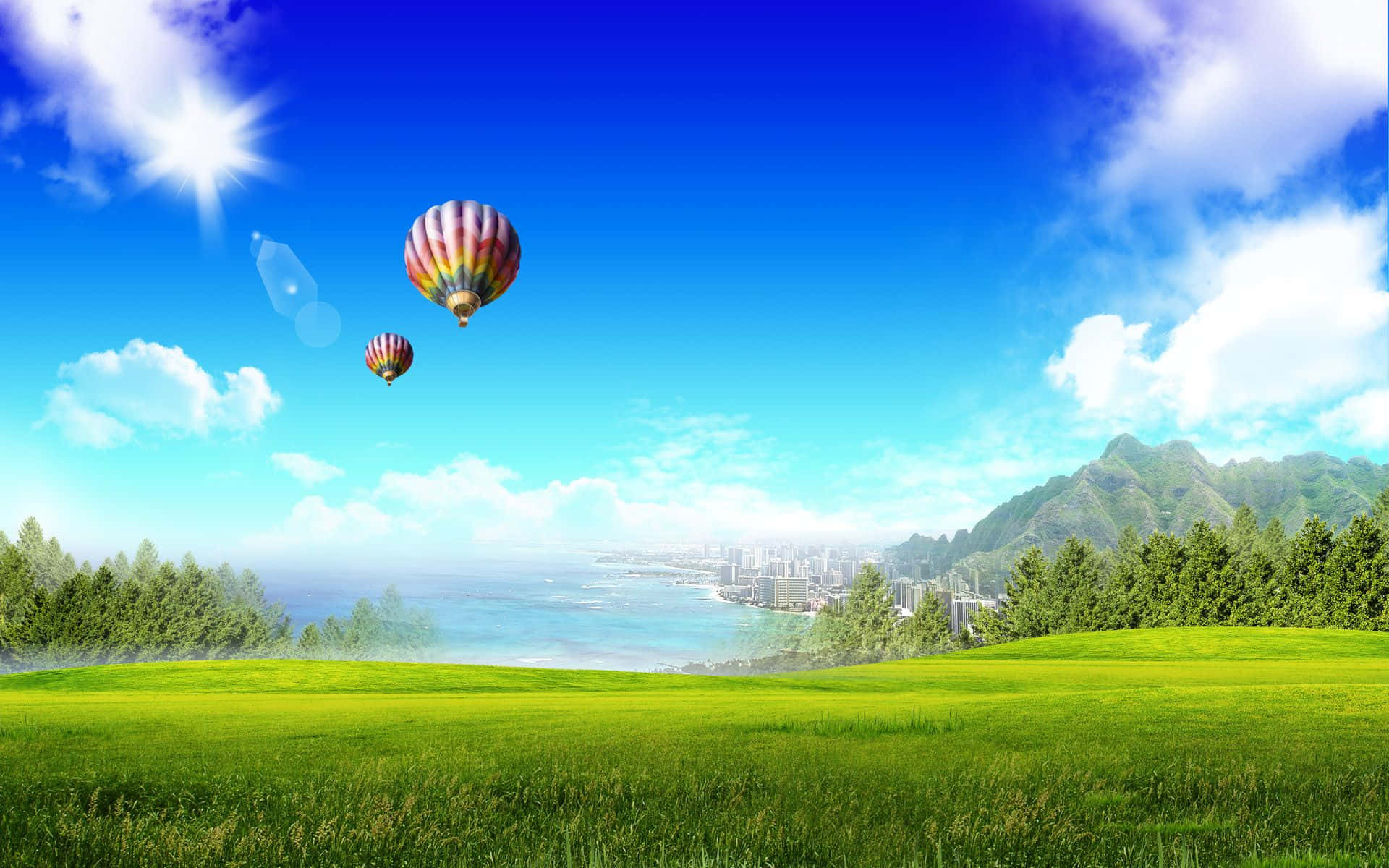 Summer Landscape 桌布 壁紙 — 兩個色彩繽紛的熱氣球在充滿活力的綠色田野上空飄移，朝向一個坐落在霧氣繚繞的山巒之間的沿海城市，天空湛藍明亮。
