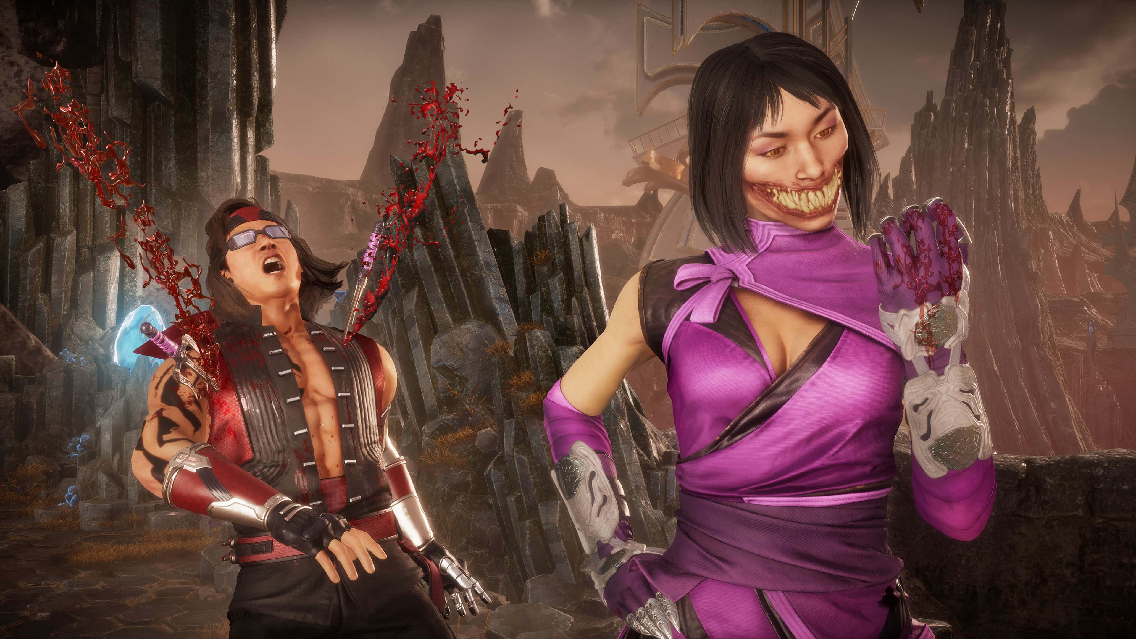 Mortal Kombat Mileena 桌布 壁紙 — 兩個血跡斑斑的動漫戰士在一個破損的石頭競技場中，周圍有鋸齒狀的尖塔和紅色飛濺效果。