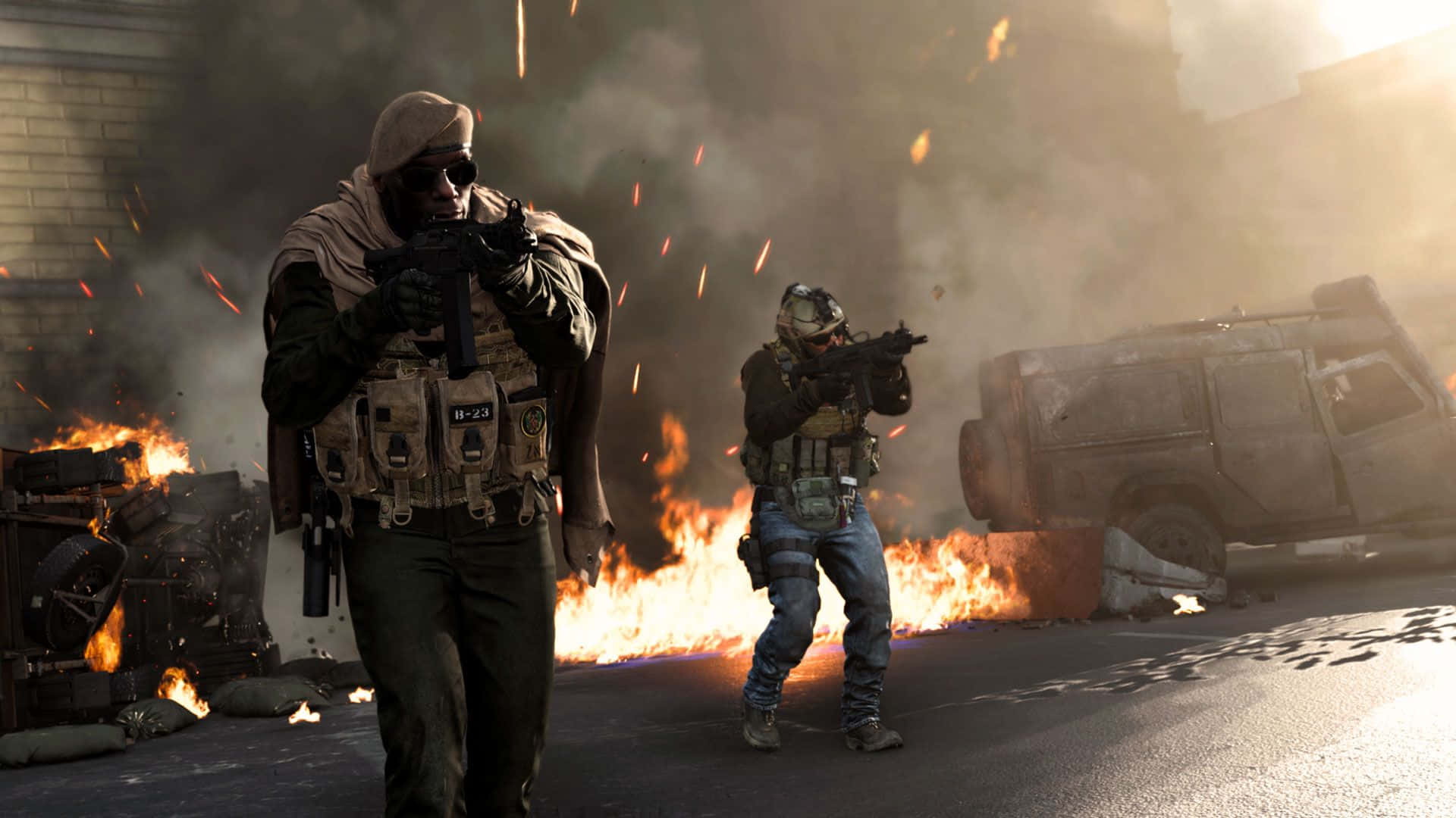 Call Of Duty Battles 桌布 壁紙 — 兩名士兵在燃燒的城市街道上前進，周圍有火焰、煙霧和碎片。