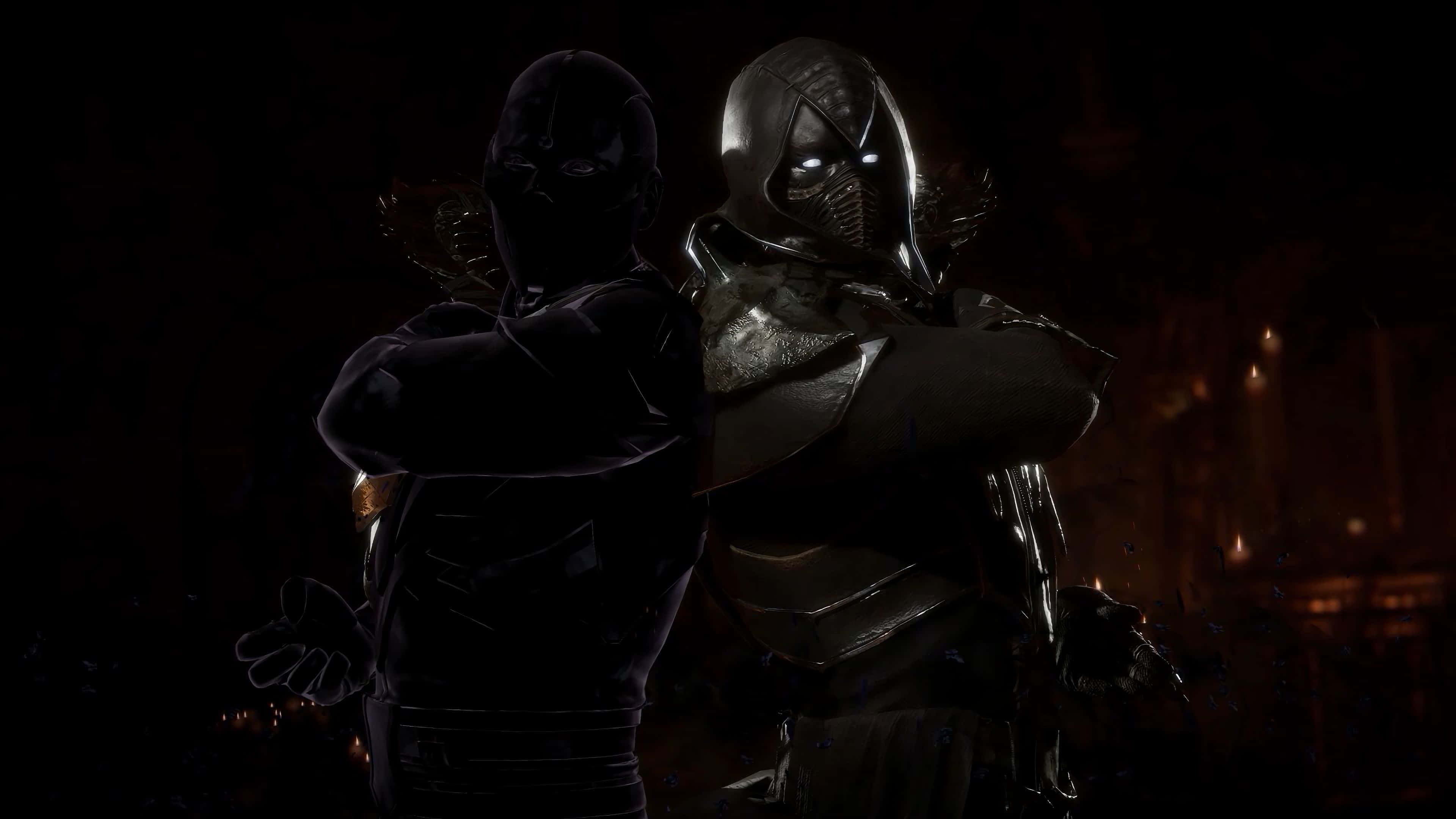 Mortal Kombat Noob Saibot 桌布 壁紙 — 兩名戴面具的戰士身穿暗色盔甲，站在燈光昏暗的競技場中，眼睛發光，陰影效果強烈。