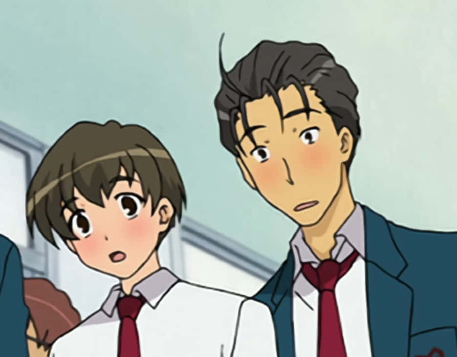 Haruhi Taniguchi 桌布 壁紙 — 兩名穿著校服的動漫學生在淡藍色背景前，臉頰泛紅，露出驚訝的表情。