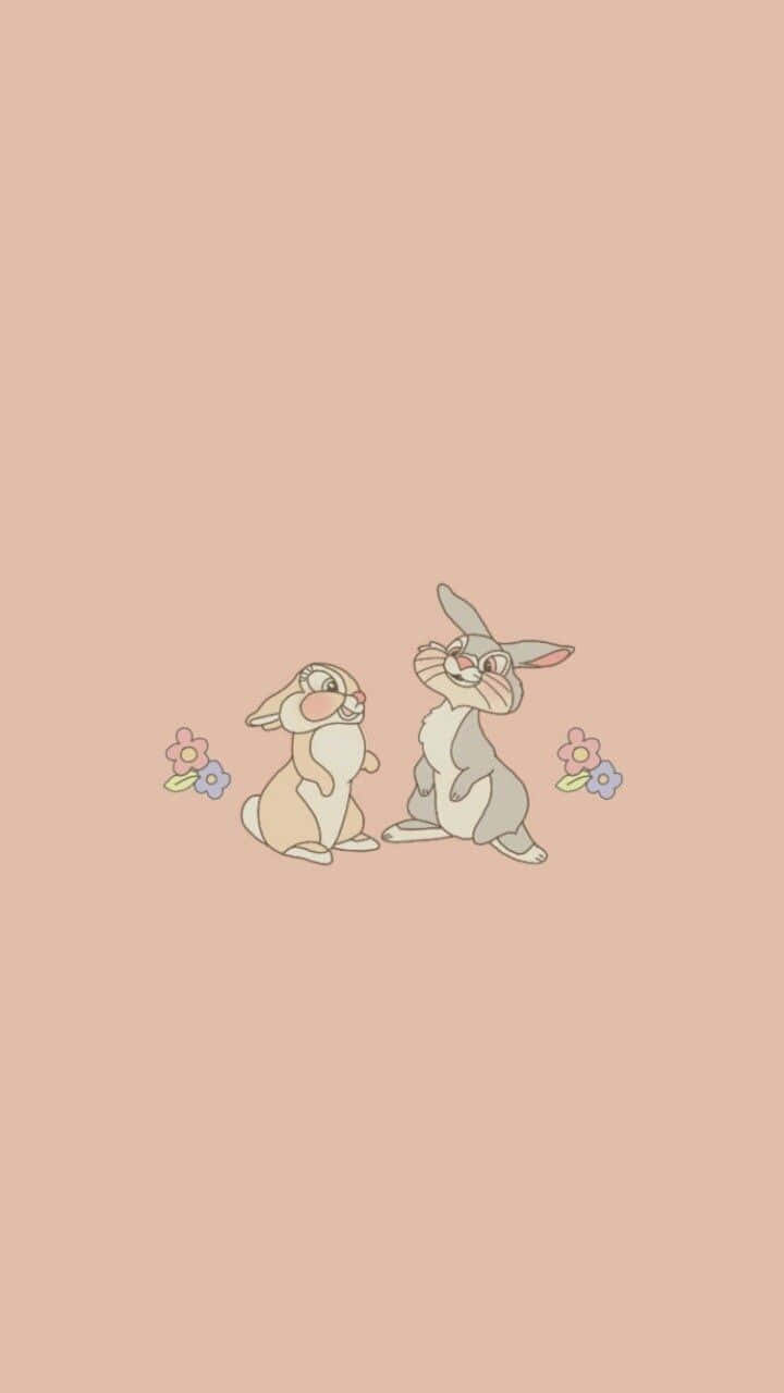 Miss Rabbit 桌布 壁紙 — 兩隻可愛嘅卡通兔仔面對面坐喺柔軟嘅桃色背景上，旁邊有細小嘅花朵。