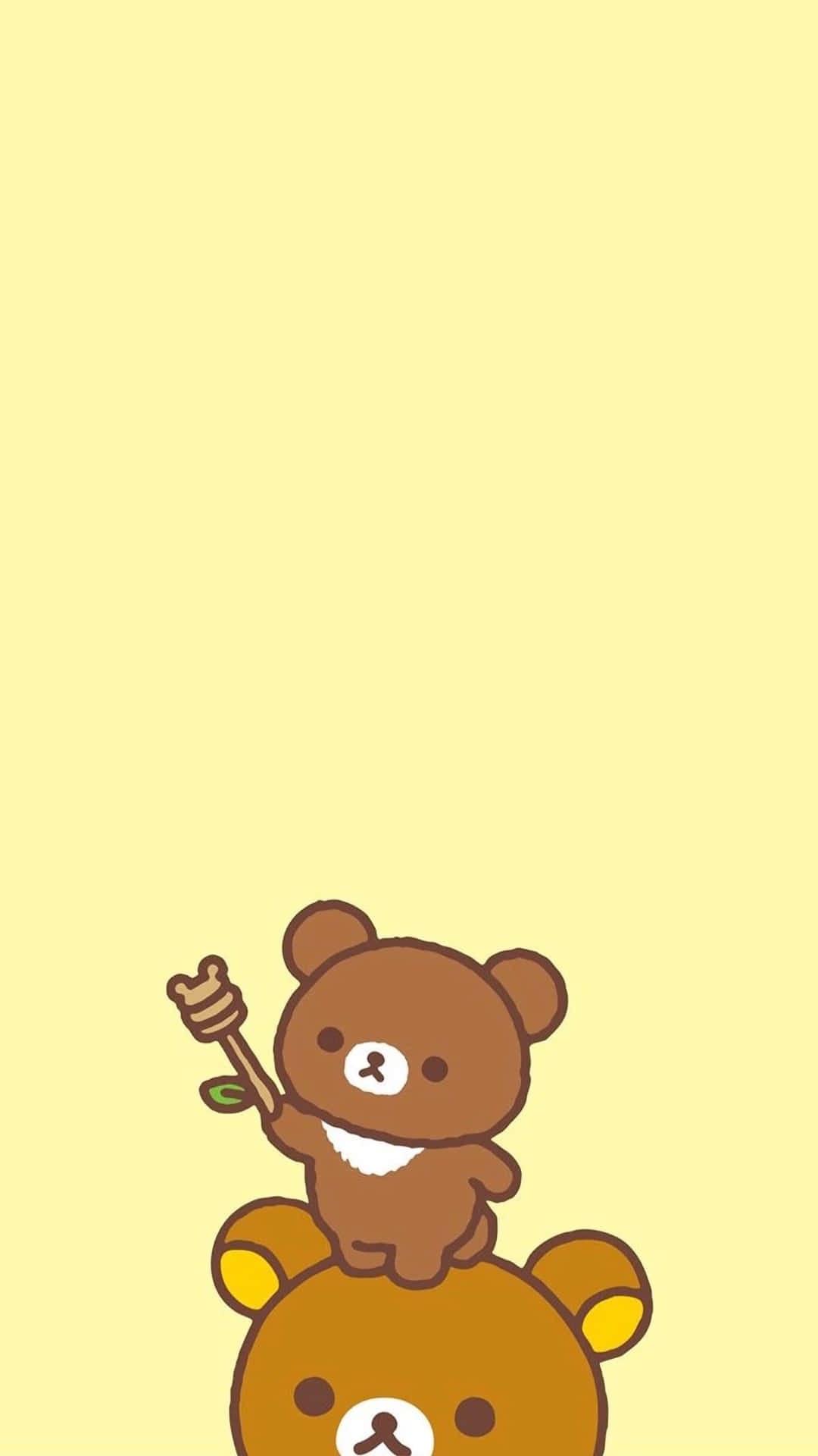 兩隻卡通小熊，一隻疊在另一隻上面，拿著蜂蜜蘸棒。 — 鬆弛熊 GIF 壁紙