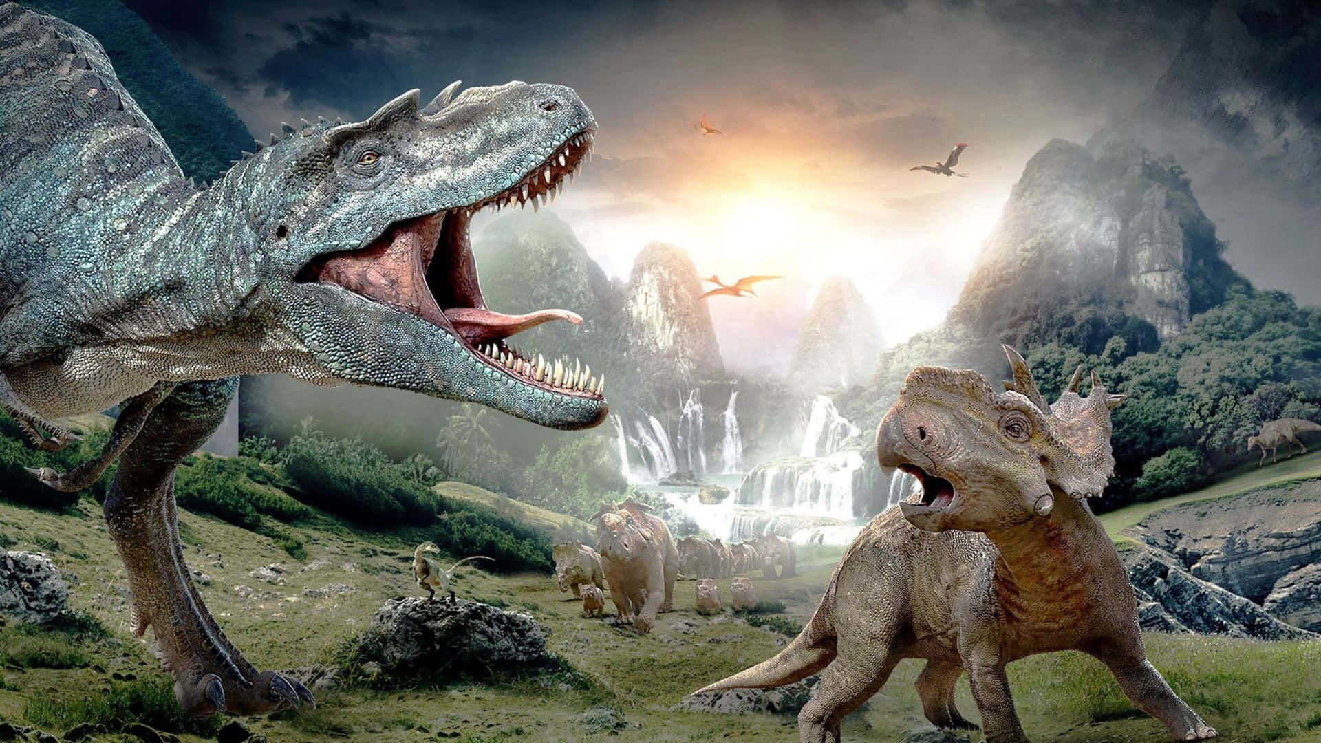 3d Dinosaur 桌布 壁紙 — 兩隻咆哮的恐龍在霧氣瀰漫的史前山谷中對峙，山谷中有瀑布和飛行的爬行動物，背景是戲劇性的日落天空。