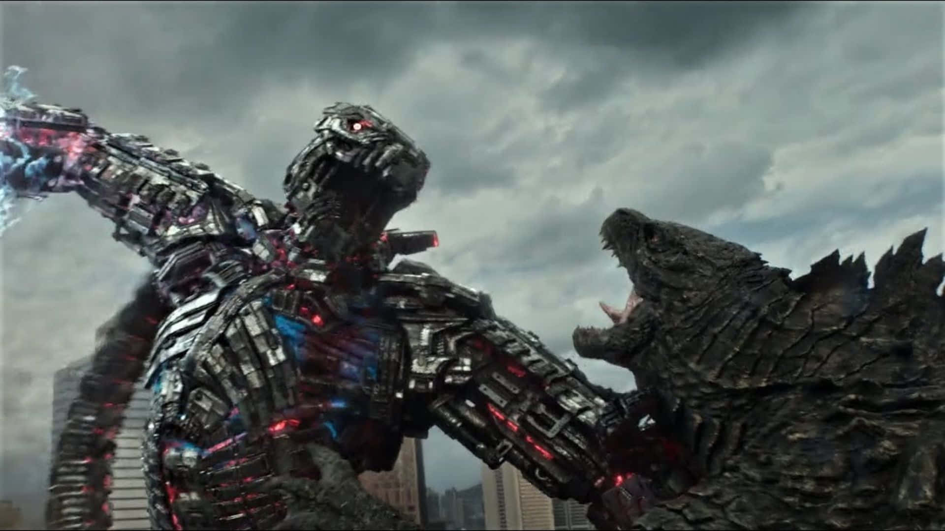 Godzilla Vs Mechagodzilla 桌布 壁紙 — 兩隻巨大的怪物在風暴天空下的廢墟城市中碰撞，一隻帶有發光紅色血管的機械改造體，另一隻原始而咆哮。
