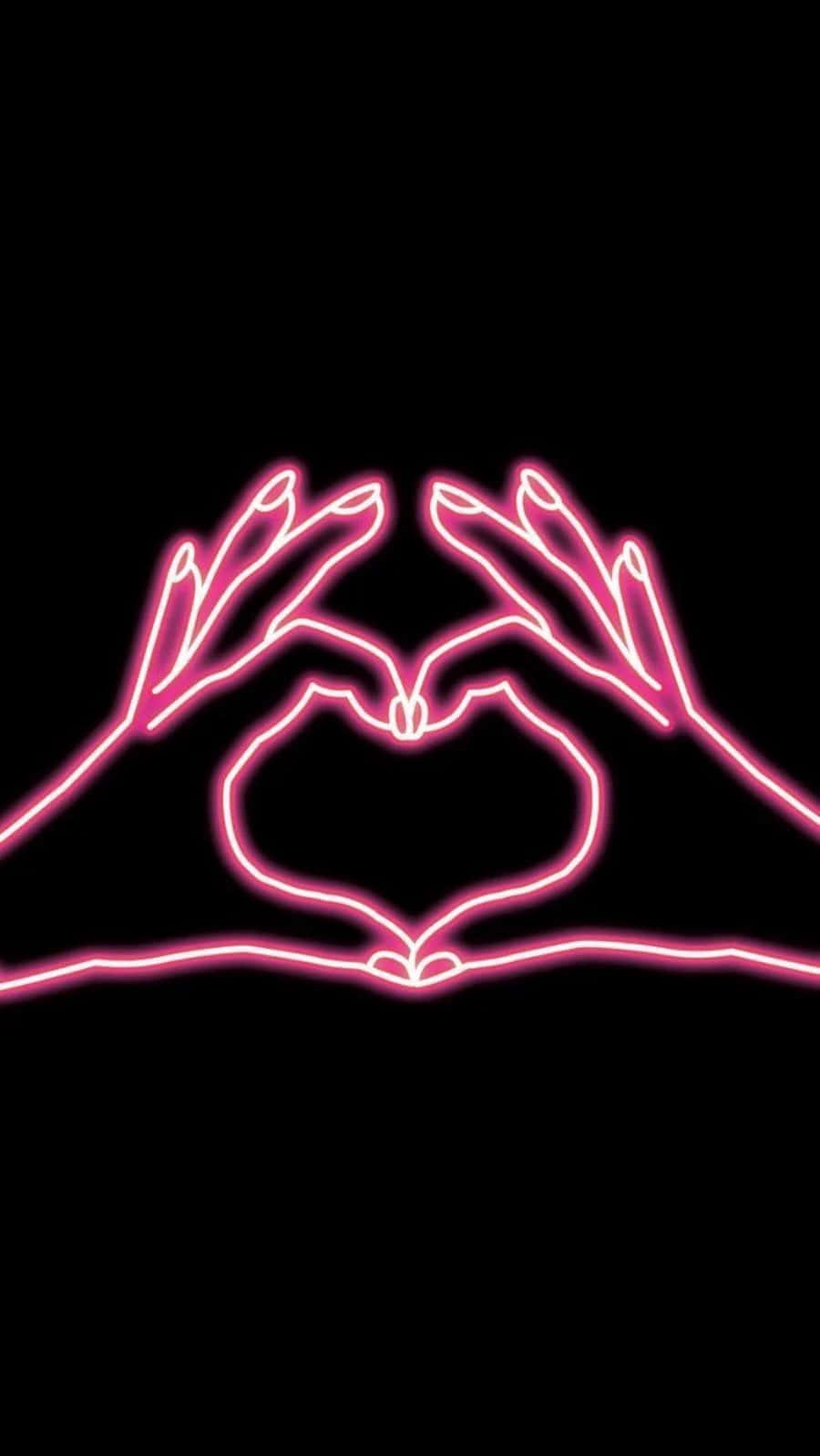 Heart Shape 桌布 壁紙 — 兩隻發光的粉紅色霓虹燈手在純黑色背景上形成心形。
