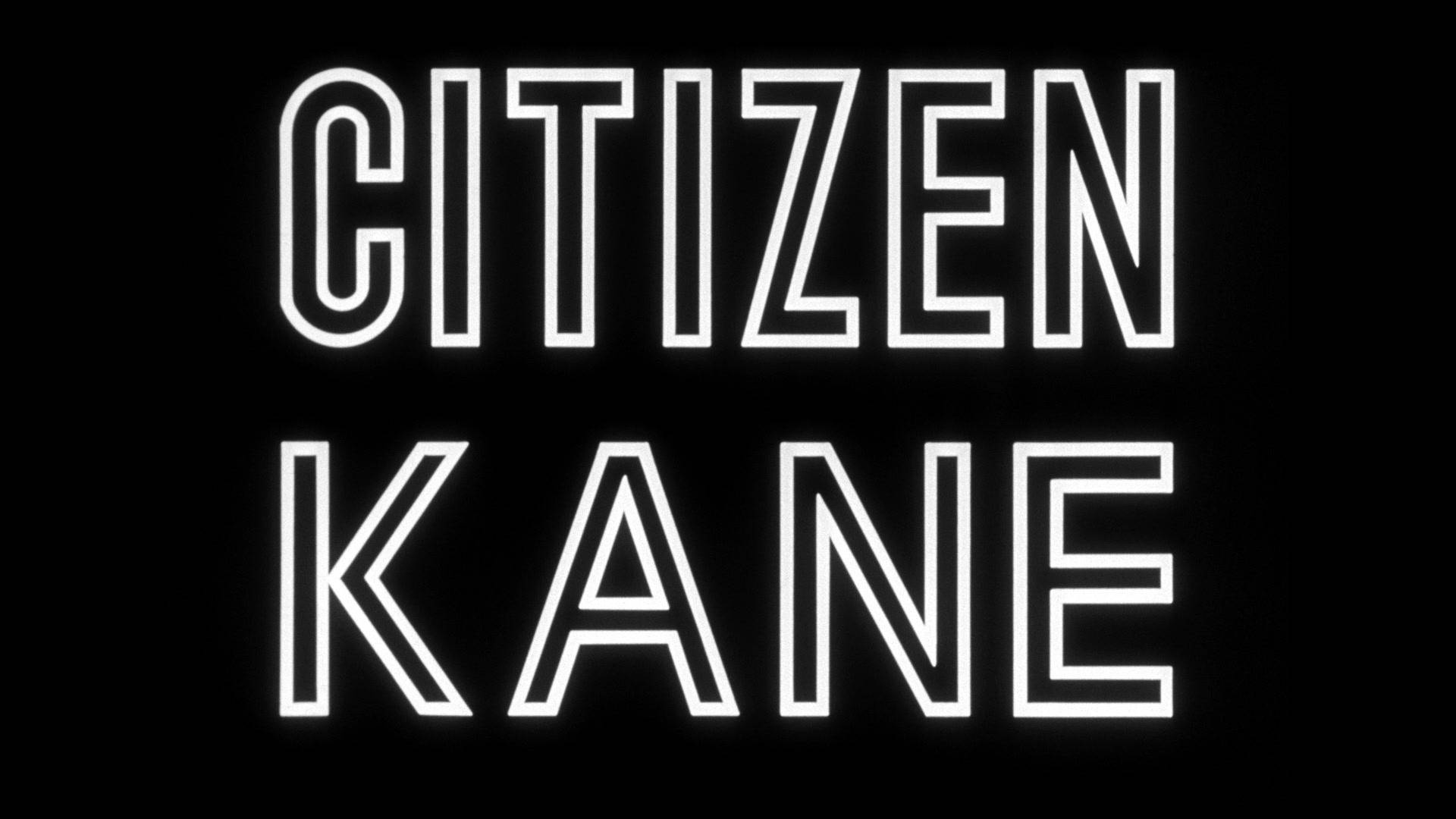 在黑色背景上發光的白色霓虹燈文字「Citizen Kane」。