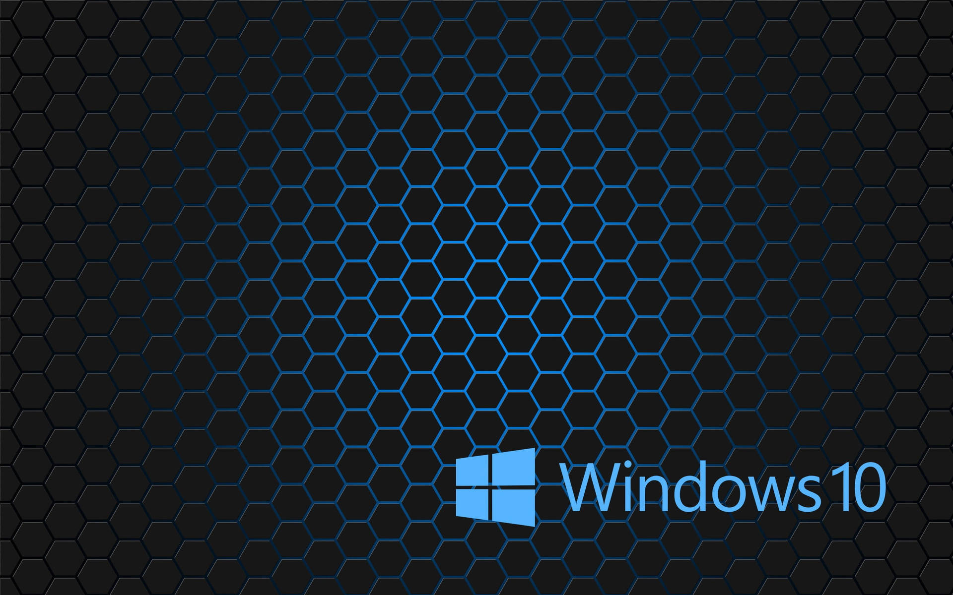 Windows 10標誌在深色六邊形圖案背景上。