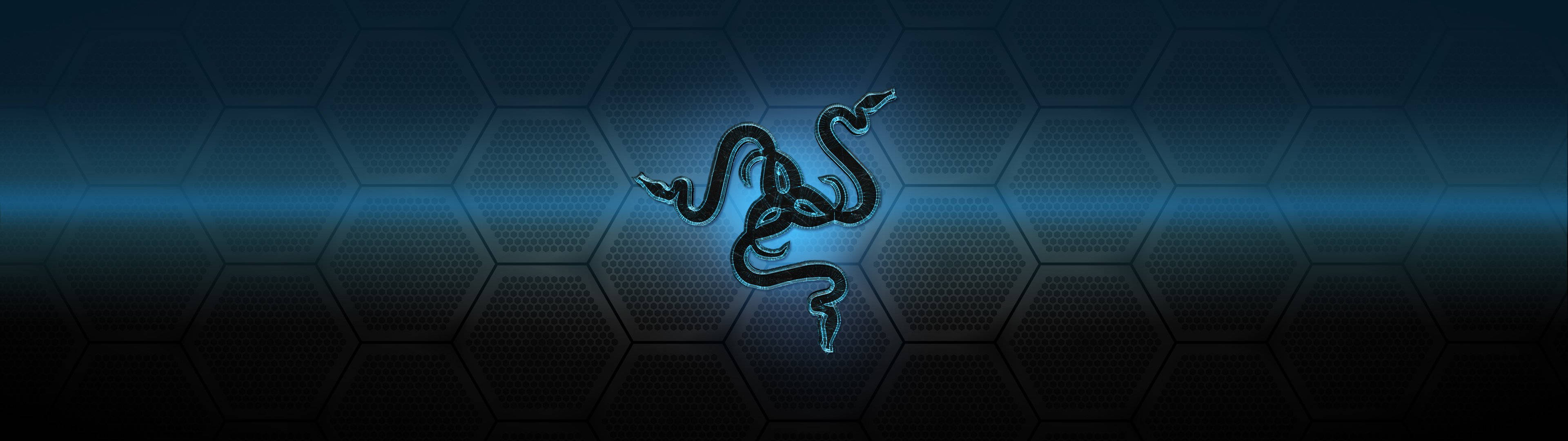 六邊形圖案背景的 Razer PC 標誌 壁紙 — 發光的藍色Razer標誌在深色六邊形圖案背景上蜿蜒，並帶有明亮的水平光條。