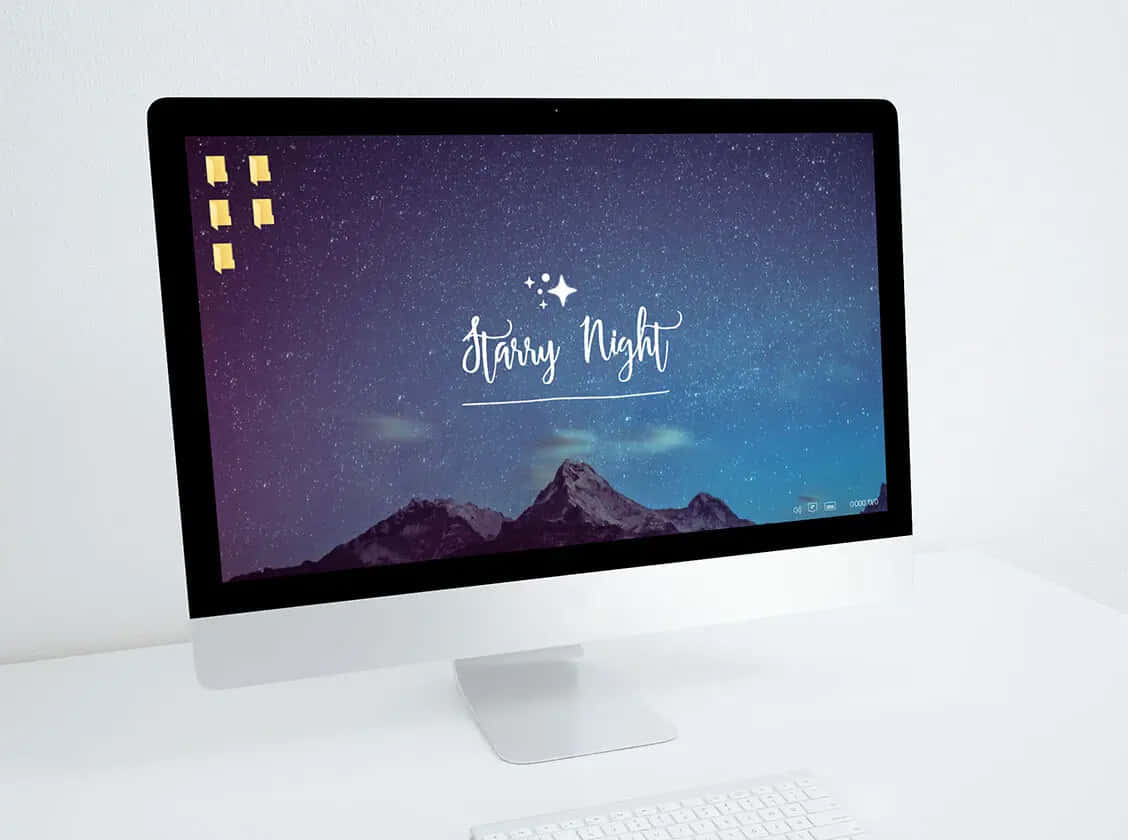 iMac顯示帶有發光文字的星空山脈桌布