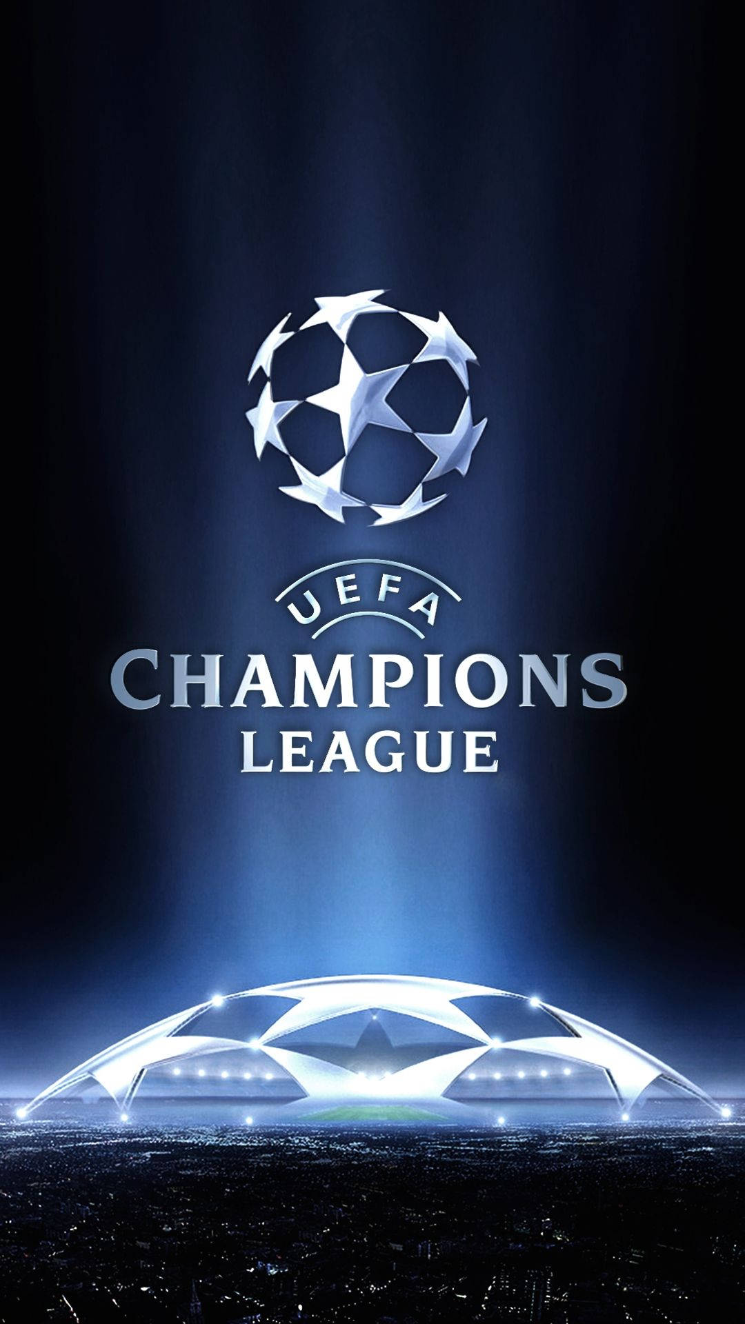 UEFA Champions League 標誌在發光的體育場上方被照亮。
