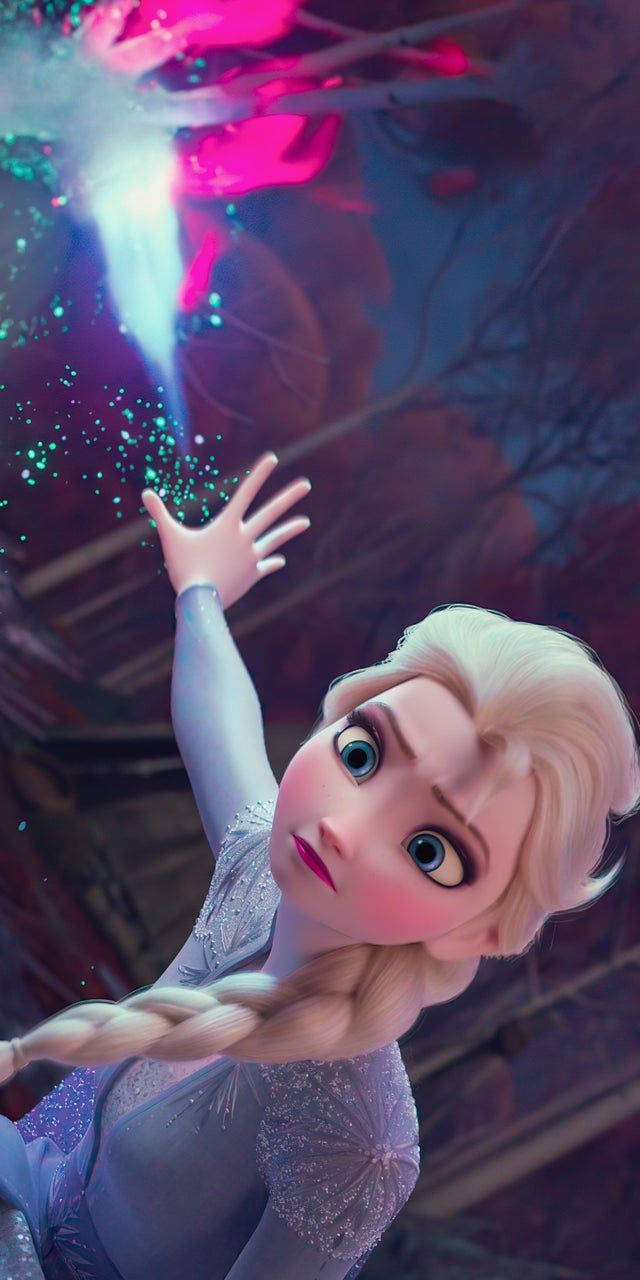 愛莎 桌布 壁紙 — 《冰雪奇緣》的艾莎伸出手，魔法冰晶在她周圍旋轉，構成充滿活力的冬日場景。