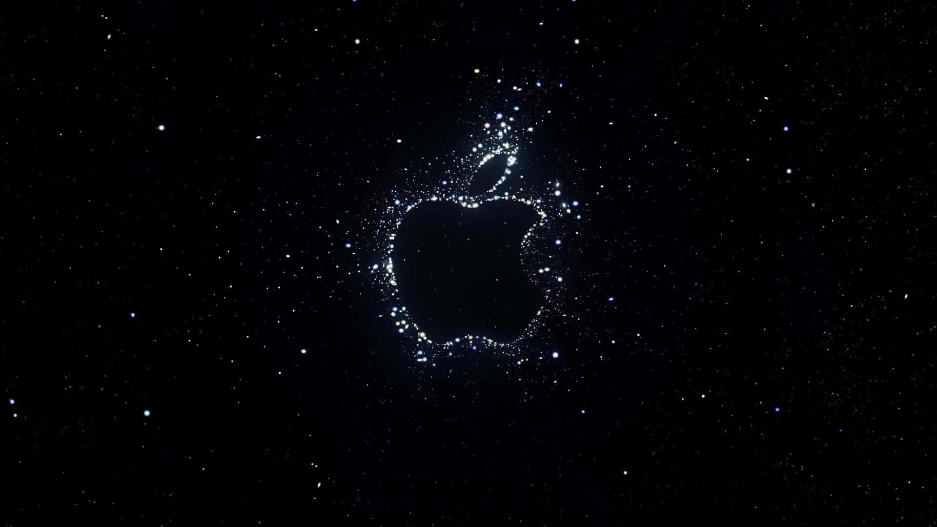在星空夜空中由發光粒子組成的Apple標誌輪廓。