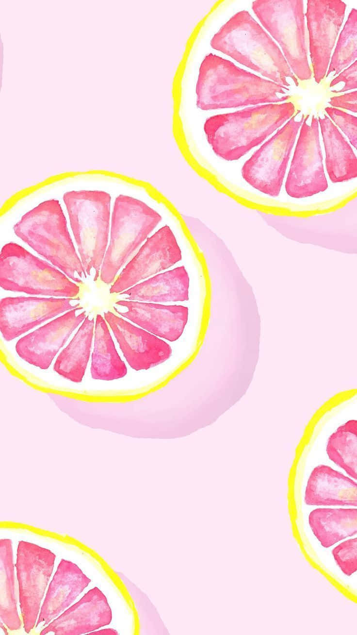 Pink Lemonade 桌布 壁紙 — 切片粉紅西柚帶黃色果皮漂浮在柔和粉彩粉紅色背景上，以水彩風格呈現。