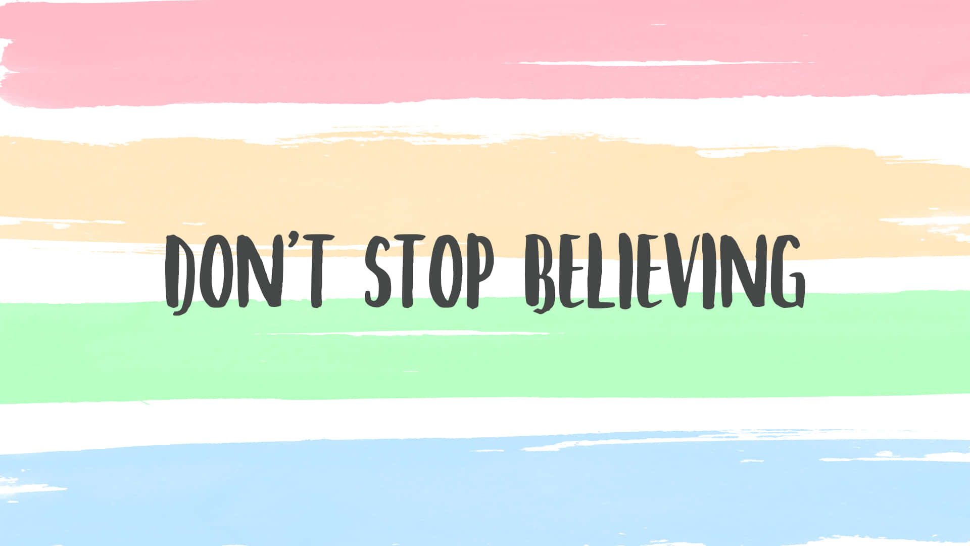 勵志名言 don't stop believing 在粉彩筆觸背景上。