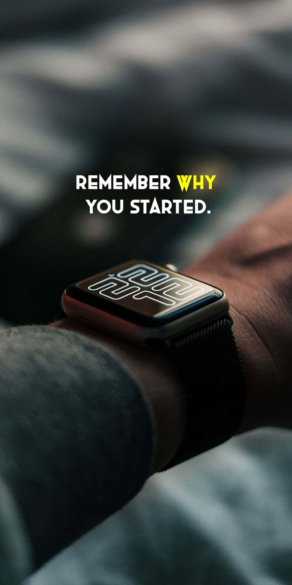 手腕上的智能手錶，帶有文字「remember why you started」。