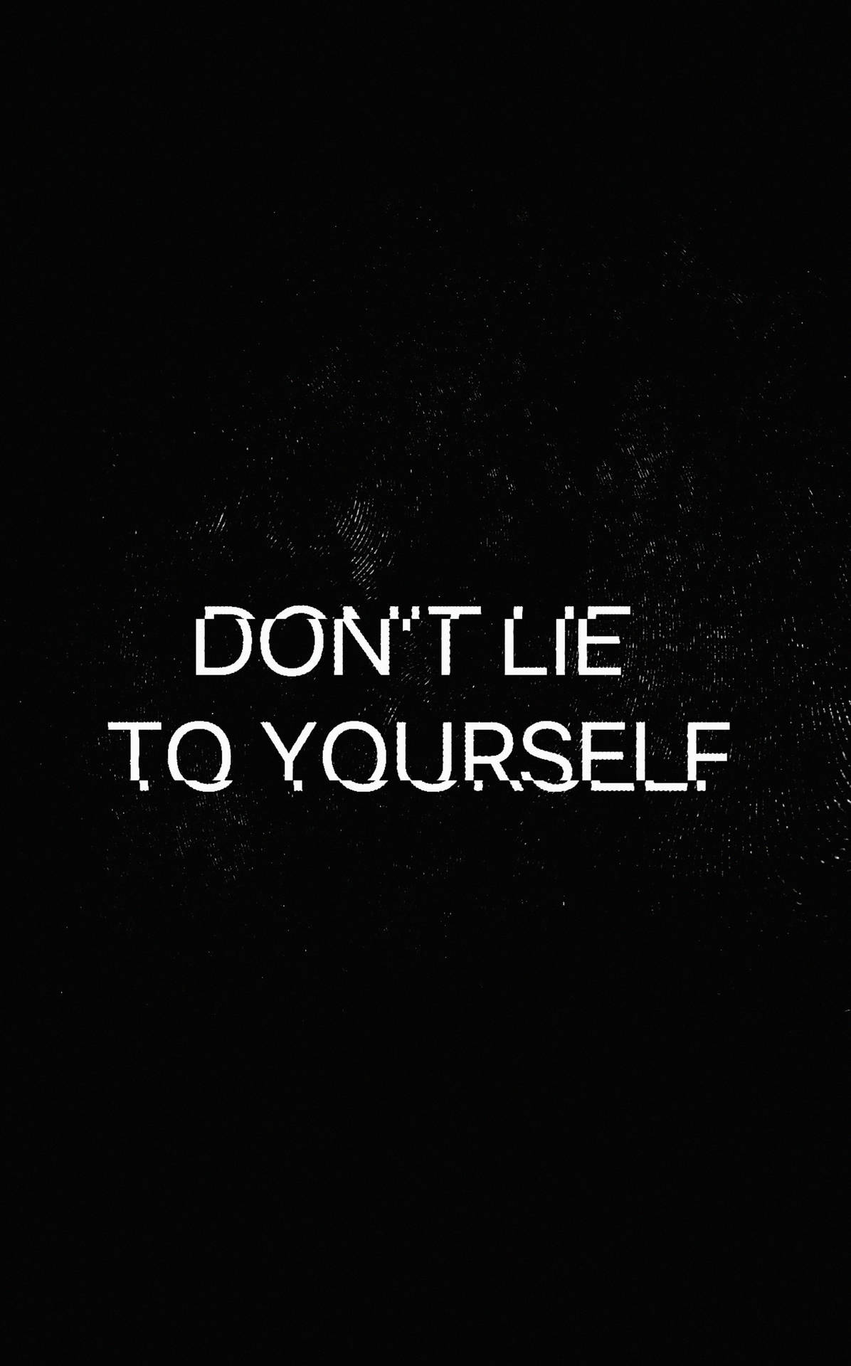 在黑色紋理背景上寫著 don't lie to yourself 的文字引用