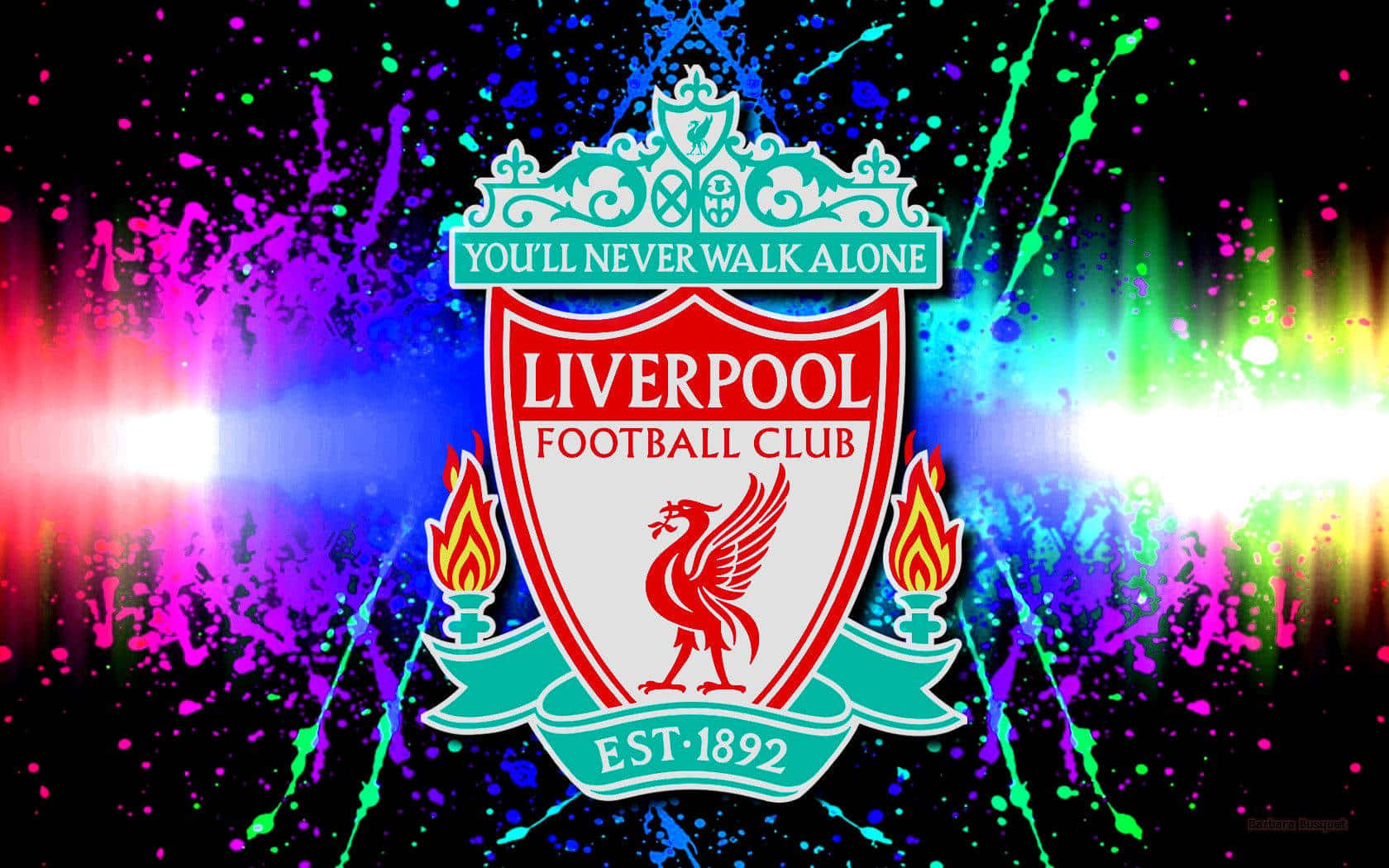 Liverpool 桌布 壁紙 — 利物浦足球會徽章在充滿活力的霓虹潑濺背景上發光，伴隨著耀眼的光芒爆發。