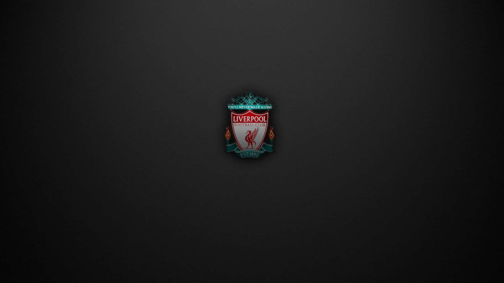 Liverpool 桌布 壁紙 — 利物浦足球會徽章置於深色漸變背景中央，帶有細微燈光效果。