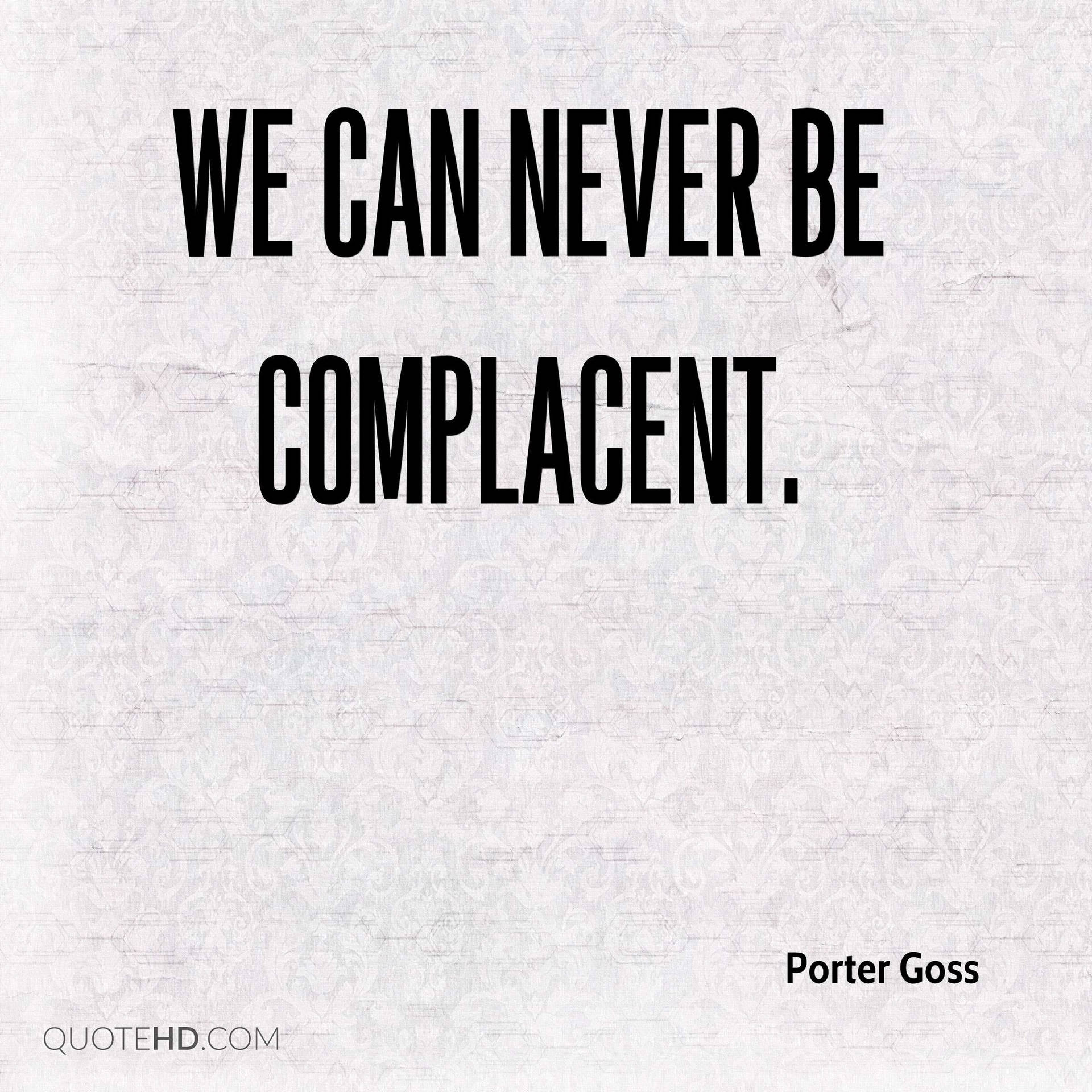 Porter Goss 的勵志名言文字「我們永遠不能自滿」在紋理背景上。