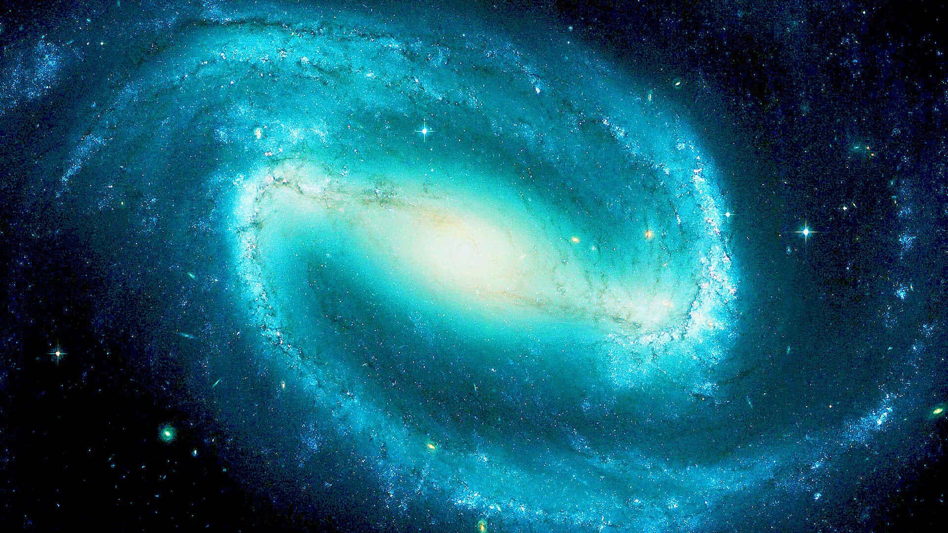 前往遙遠繁星之地，探索涼爽藍色星系 壁紙 — 一個令人嘆為觀止的螺旋星系，閃爍著青綠色的旋臂和明亮的星星，在深邃的宇宙黑色背景下旋轉。