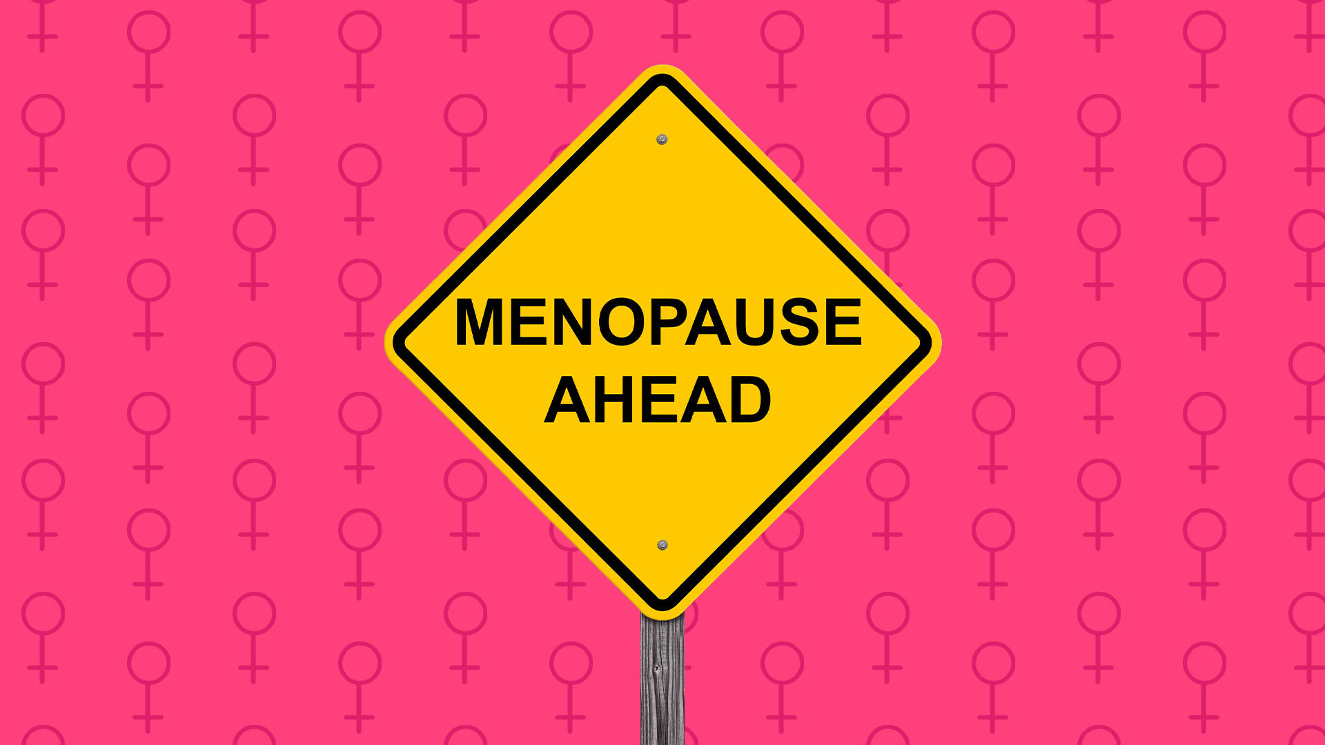粉紅色背景上帶有女性符號的黃色警告牌，寫著「Menopause Ahead」。