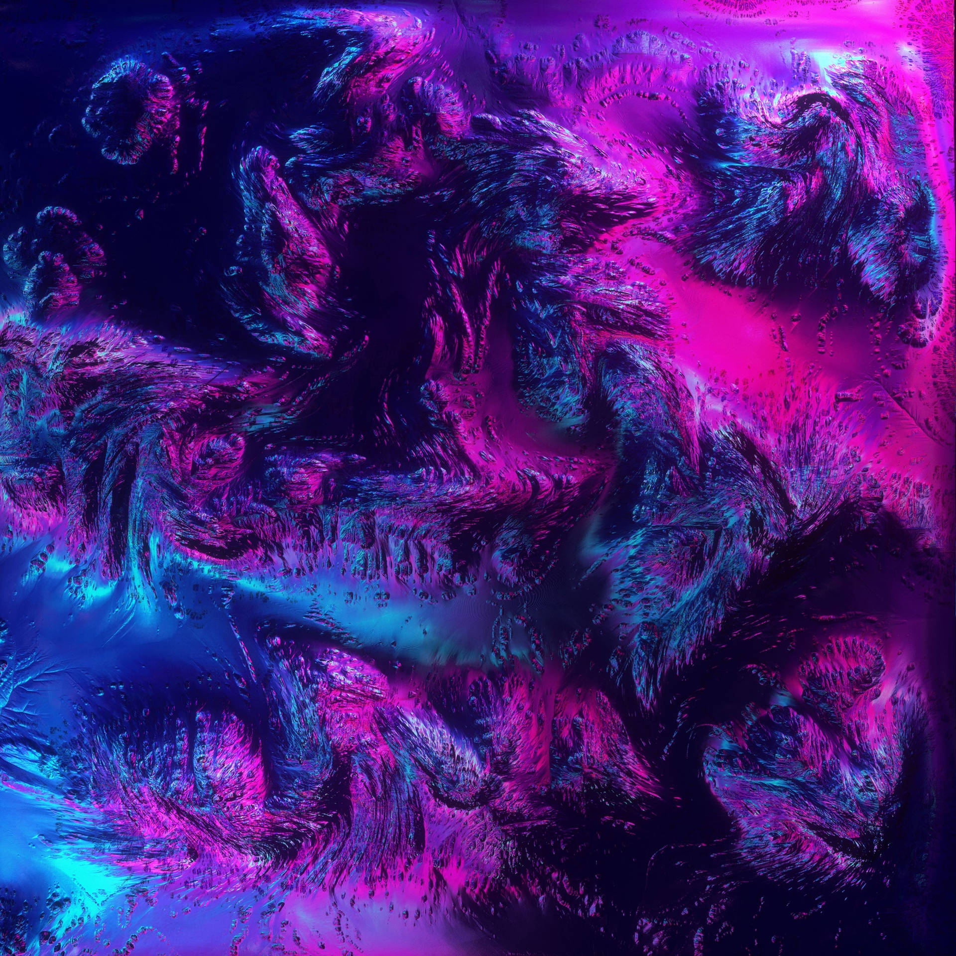 螢光粉紅和藍色分形圖案在發光的數碼抽象設計中旋轉。