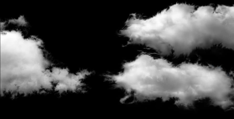 劇烈雲層與黑色天空 壁紙 — 戲劇性的白雲在漆黑的天空中飄移，呈現高對比度的單色效果。