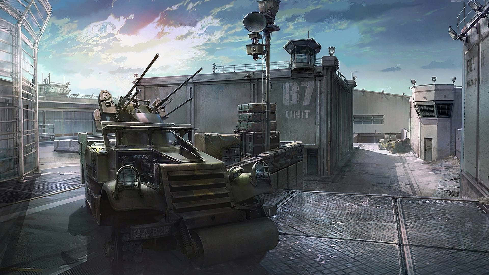 軍用裝甲車在黃昏時停放在設防的工業園區。