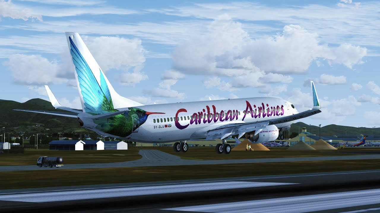 加勒比航空蜂鳥設計飛機在跑道上，天空多雲