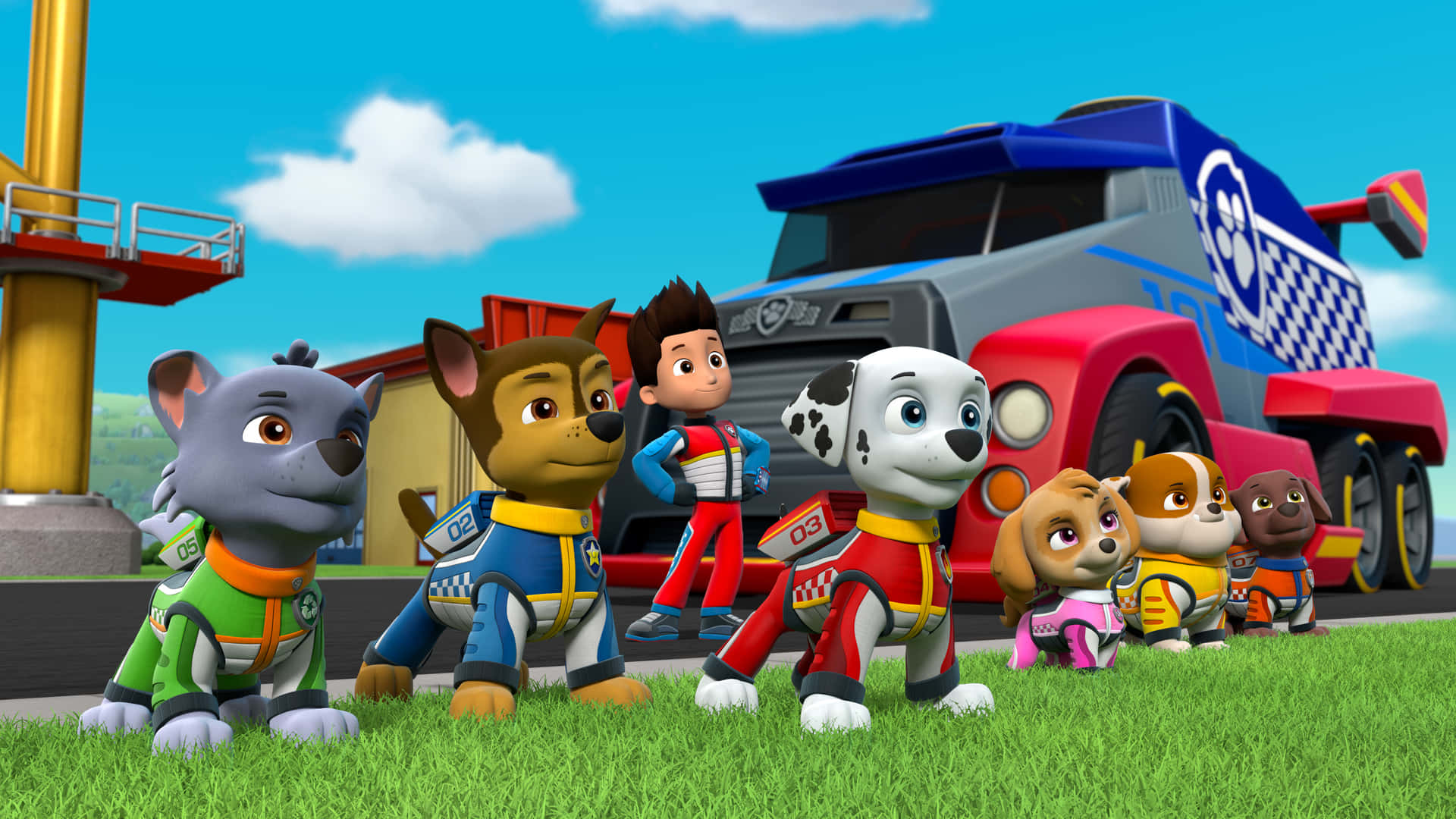 穿著救援裝備的Paw Patrol角色站在草地上，靠近一輛卡車。