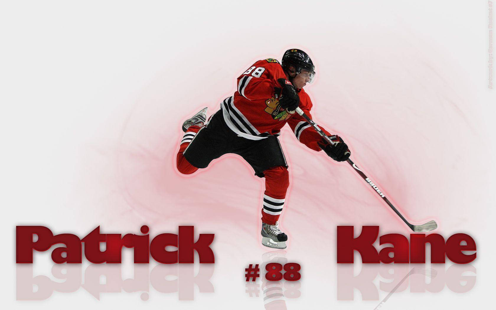 動感帕特里克·凱恩賽場瞬間 壁紙 — 冰球運動員 Patrick Kane 身穿紅色黑鷹隊球衣，在柔和的粉紅色漸變背景上動態滑行。