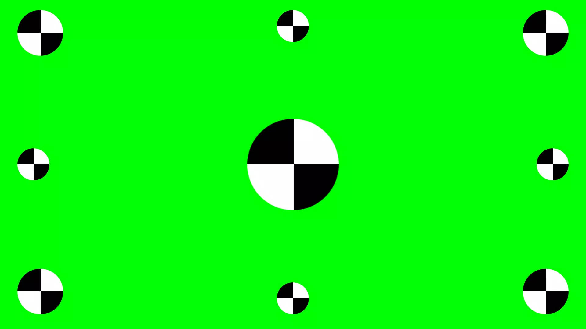帶有黑白棋盤格圓圈的綠色屏幕。
