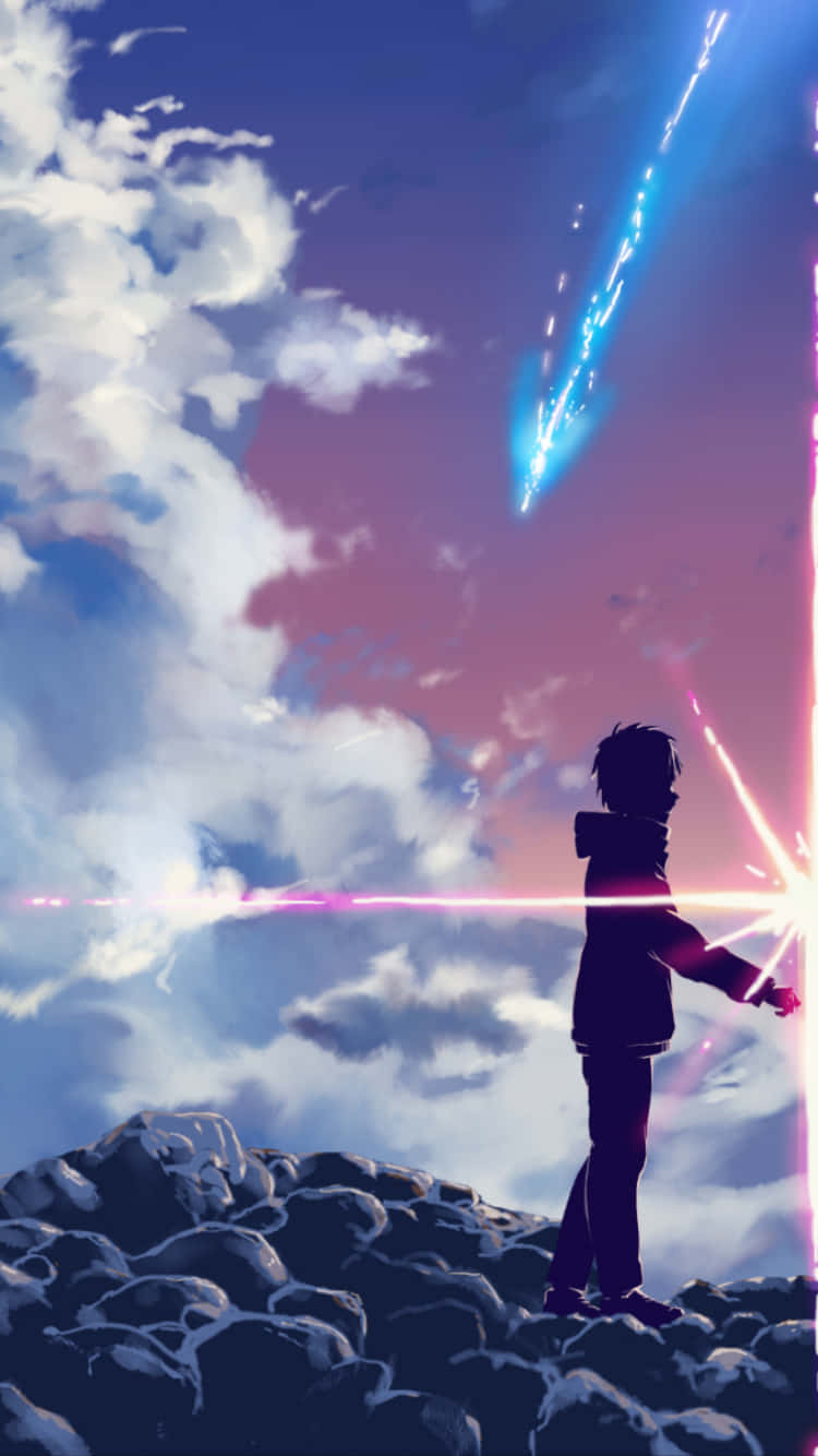懸崖上的動漫男孩看著彩色暮色天空中發光的流星