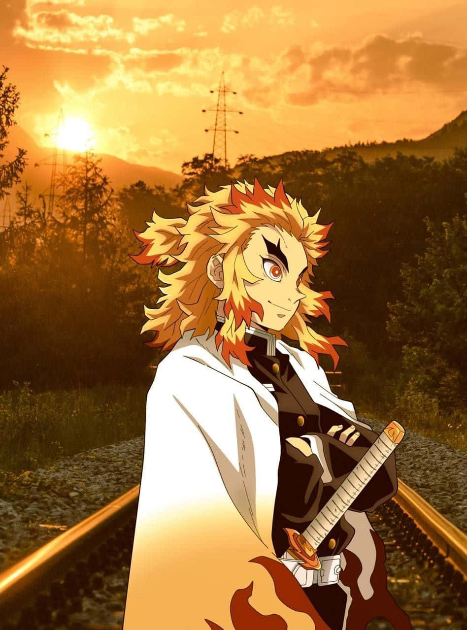 Rengoku Aesthetic 桌布 壁紙 — 動漫角色擁有火焰般的頭髮，自信地站在鐵軌上，背景是金色日落、山脈和電線。
