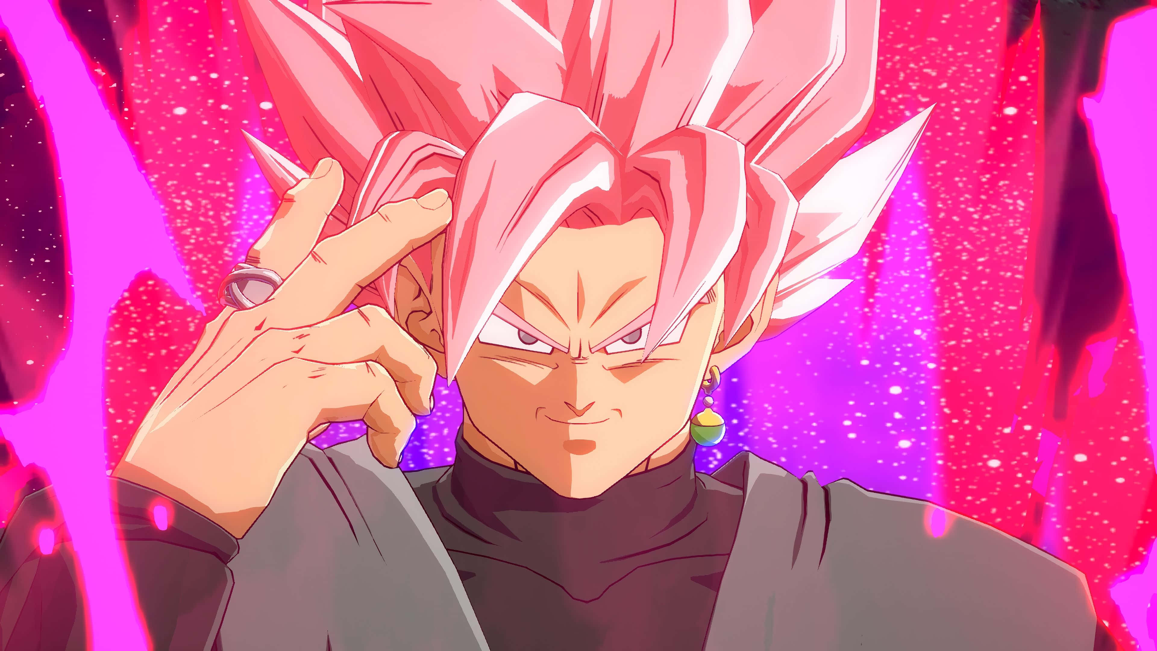 Dragon Ball Fighterz 桌布 壁紙 — 動漫角色擁有粉紅色尖刺頭髮和銳利眼神，在充滿活力的粉紅色宇宙背景前做出和平手勢。