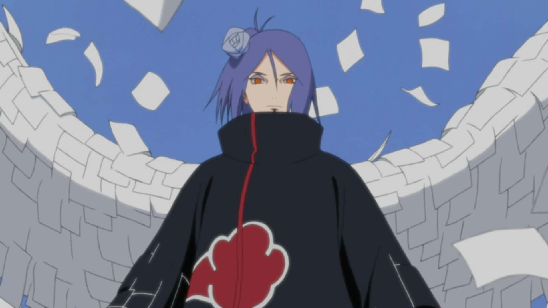Konan 桌布 壁紙 — 動漫角色紫色頭髮，身穿紅色雲朵斗篷，站在藍天下飄落的紙張中。