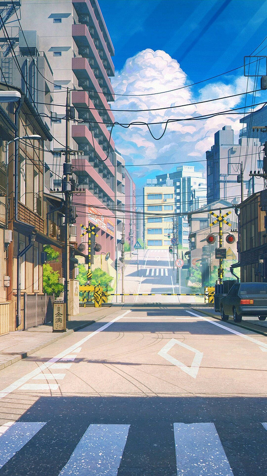 動漫風格的日本城市街道，有建築物、行人穿越道和明亮的藍天。