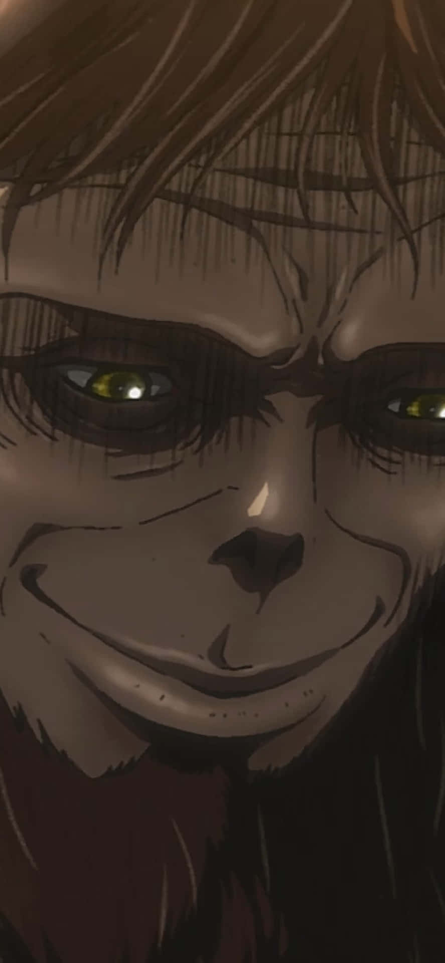 Beast Titan 桌布 壁紙 — 動畫巨人的特寫，在深色頭髮下有著發光的黃色眼睛和邪惡的笑容。
